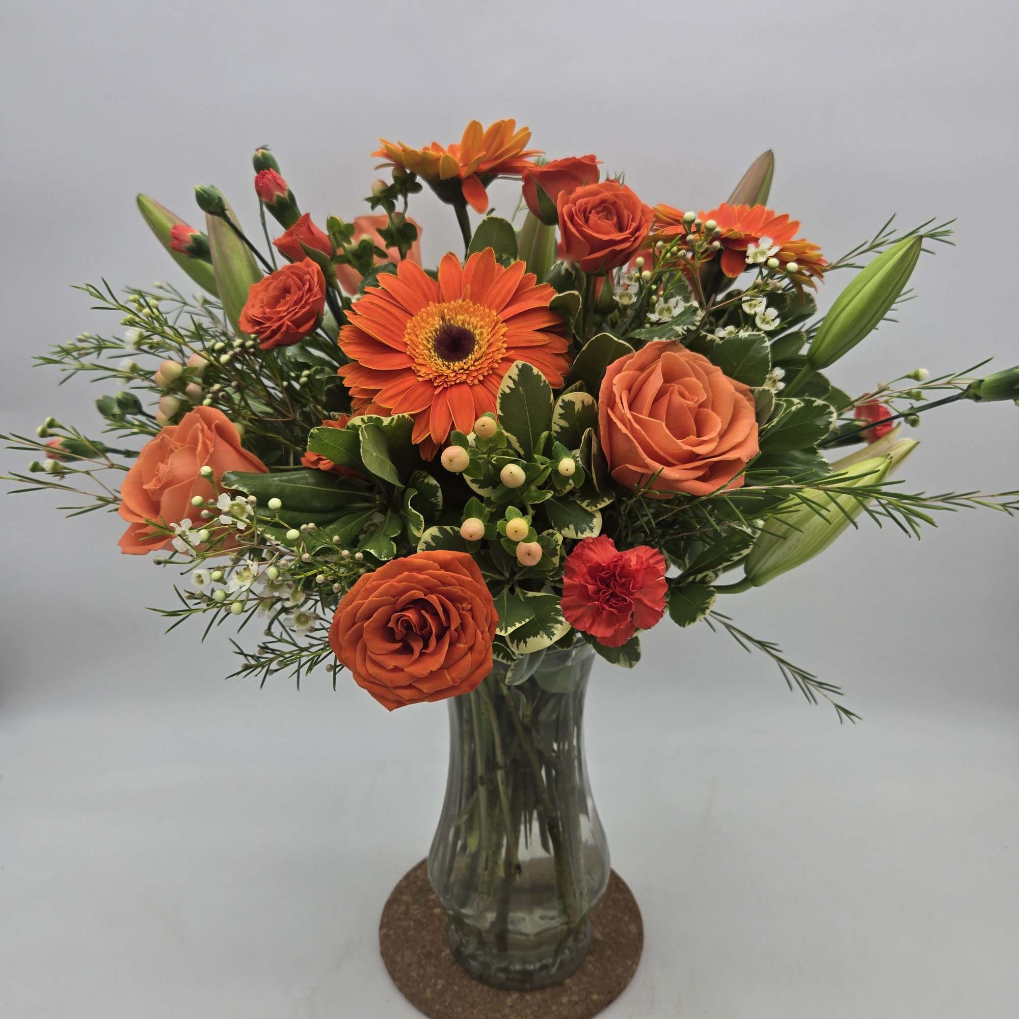 - Lilies - Spray Roses - Snapdragons - Hypericum Berries - Alstroemeria
