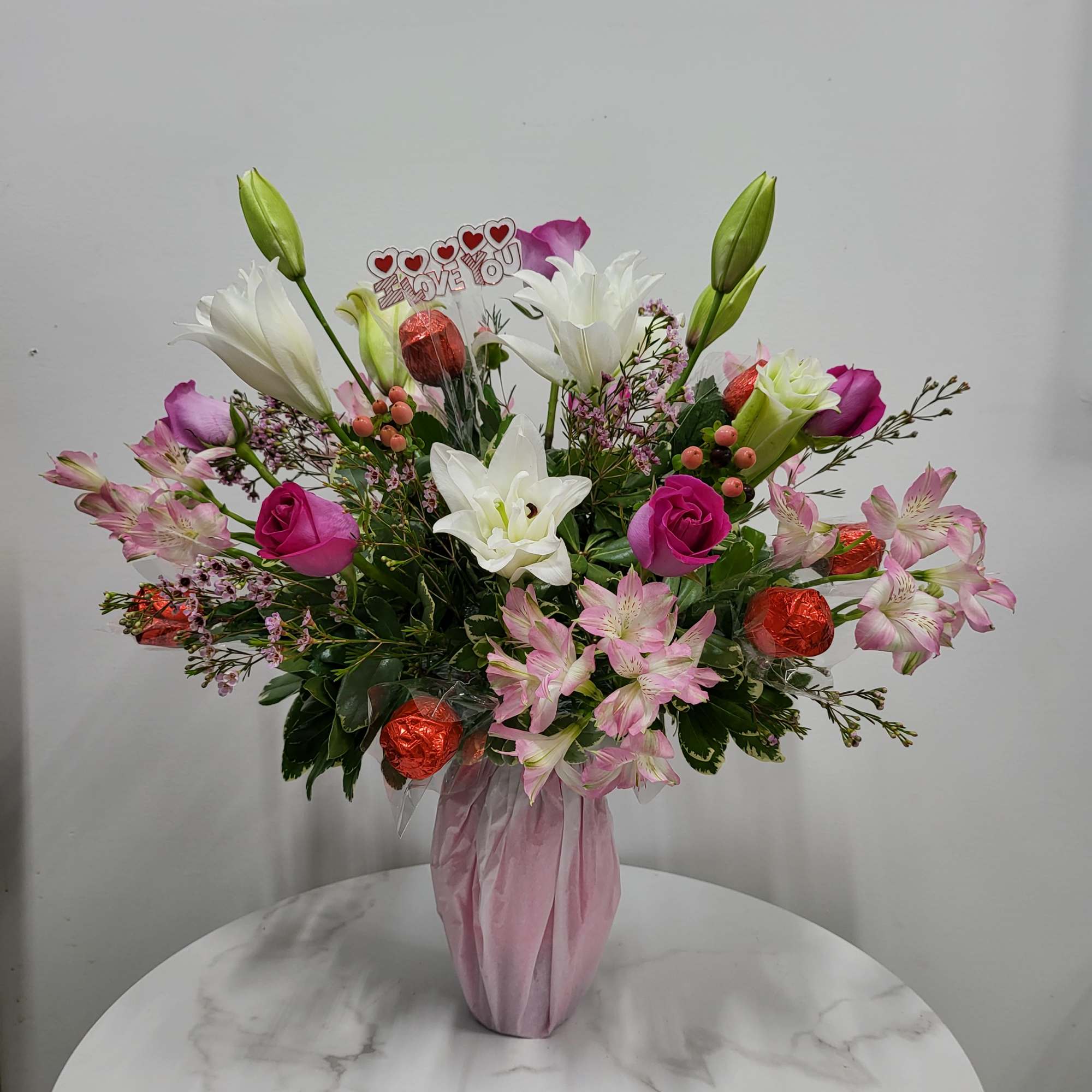 Send a full bottle of wine, flowers and chocolates