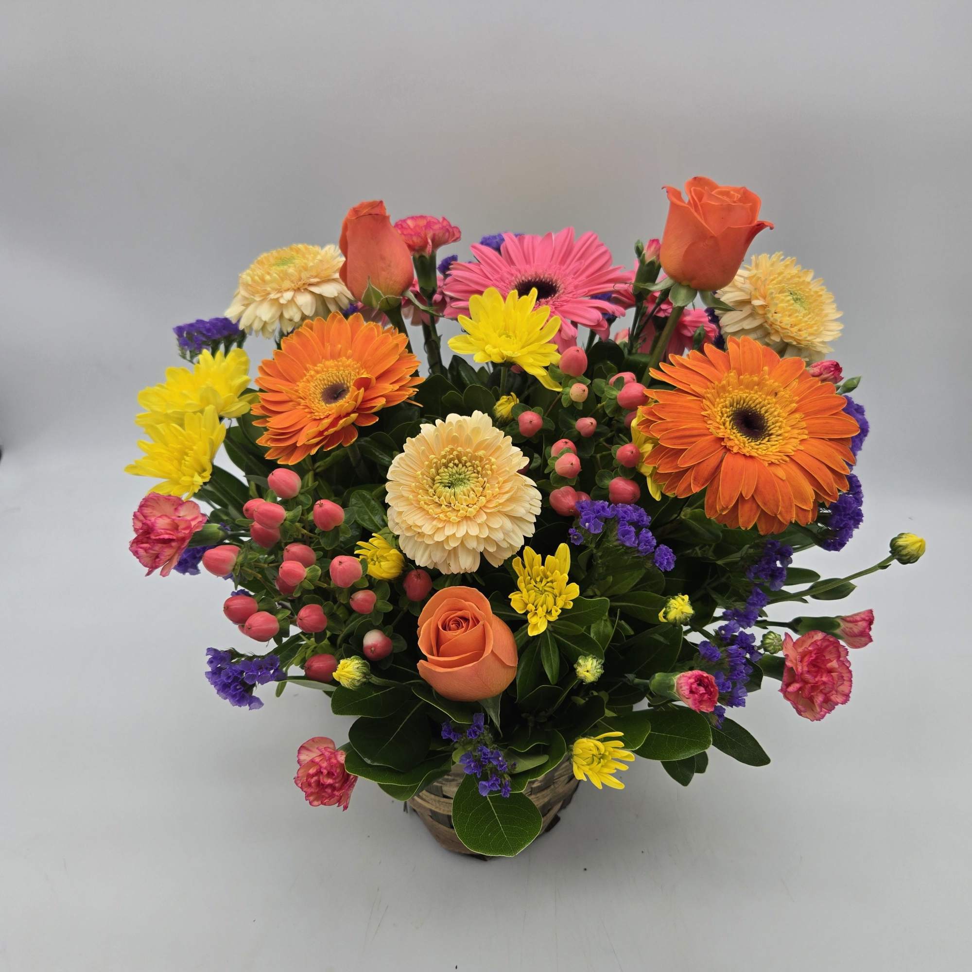 An elegant bright basket for any occasion.  Enjoy seasonal blooms in