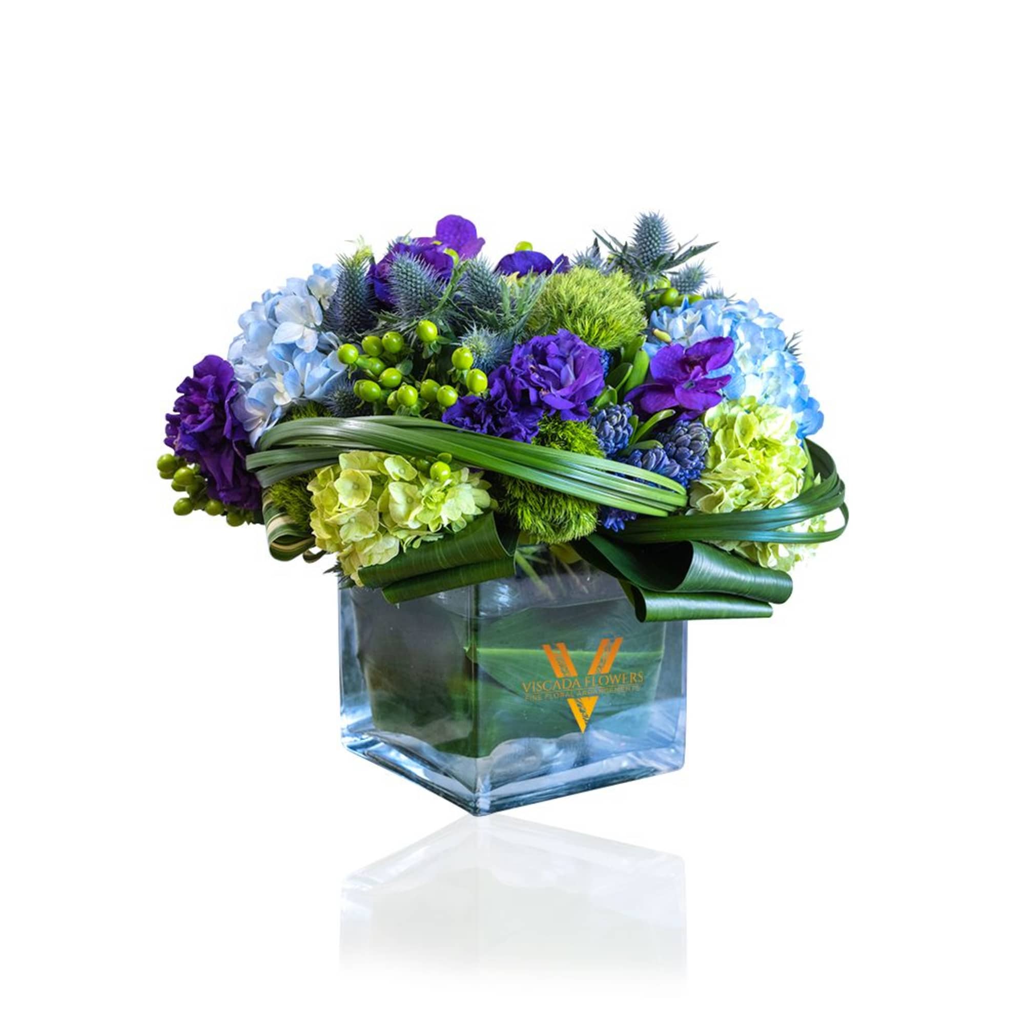 Refreshing and soothing, this bouquet combines blue hydrangeas, green dianthus, purple muscari