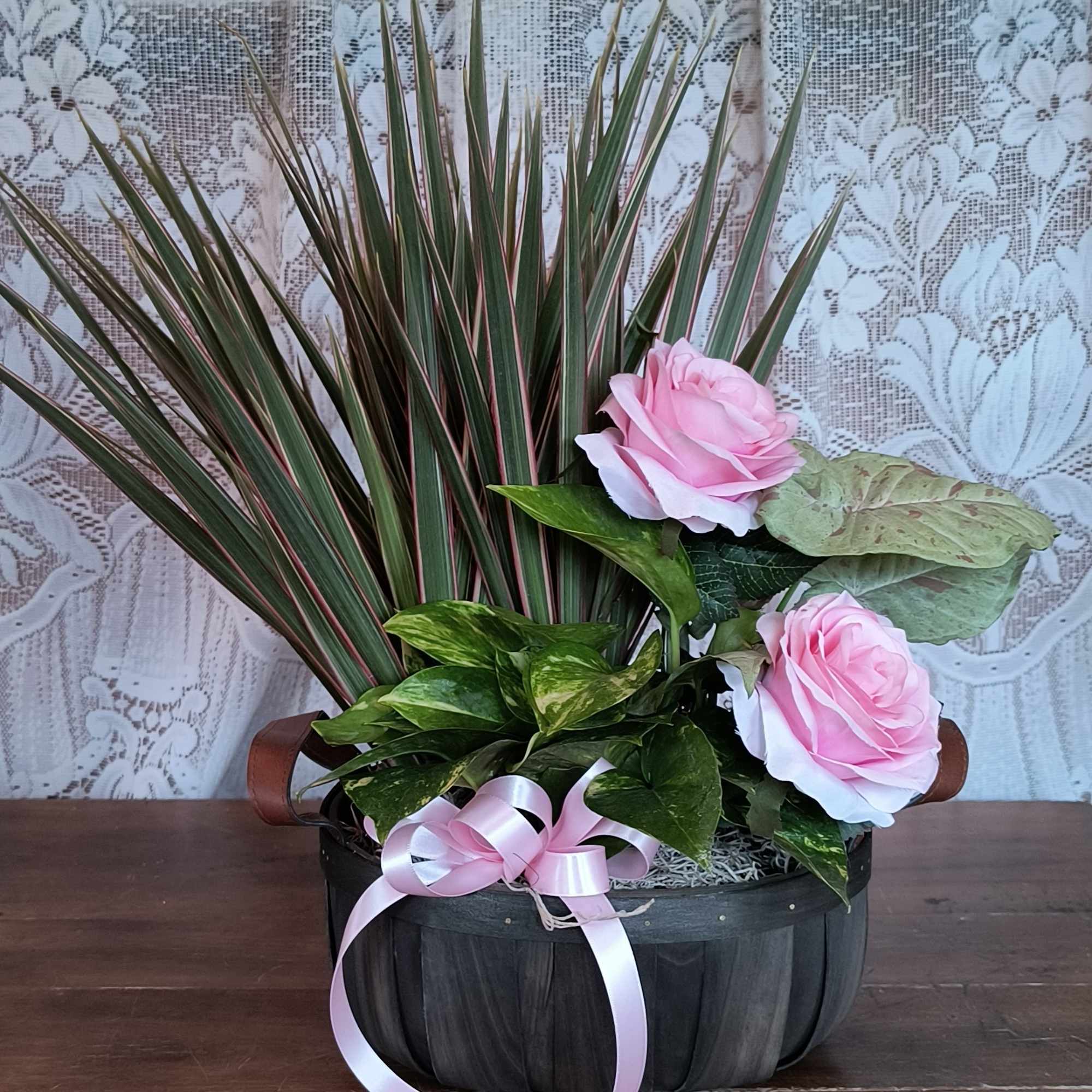 This basket of plants accented with a permanent botanical will send your This basket of plants accented with a permanent botanical will send your