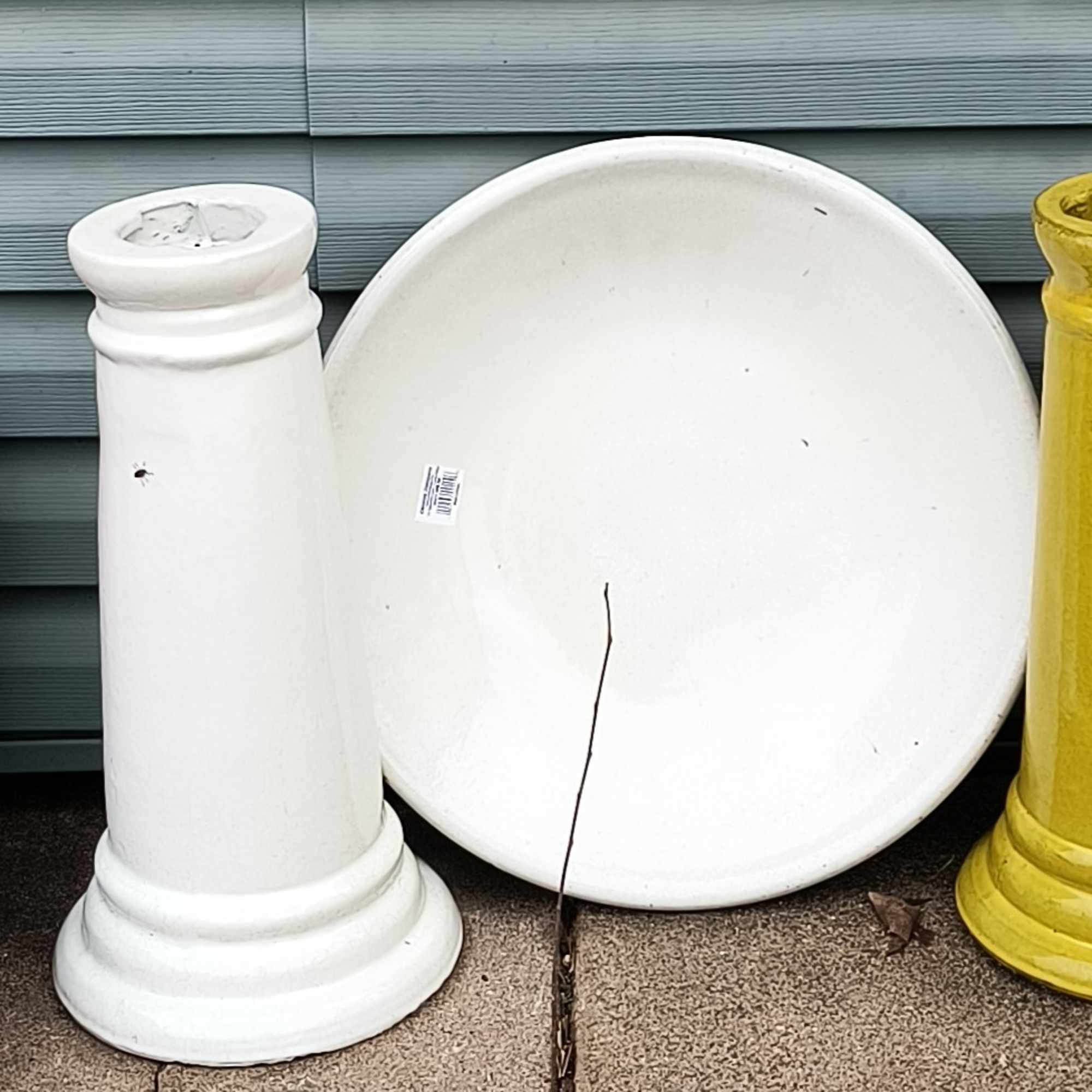 This 2 piece birdbath garden has a variety of green house plants