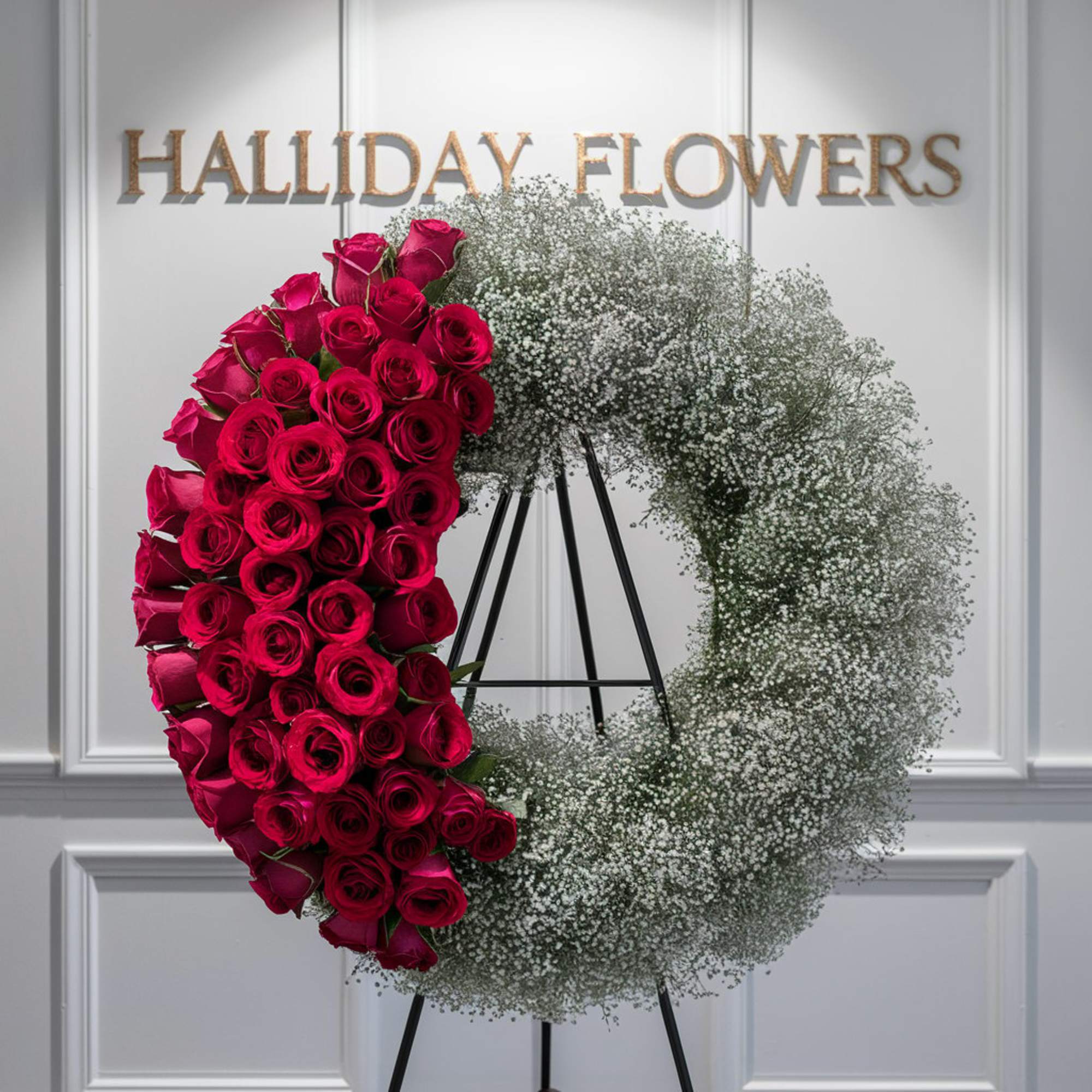  A stunning photograph of a 24-inch funeral wreath adorned with delicate
