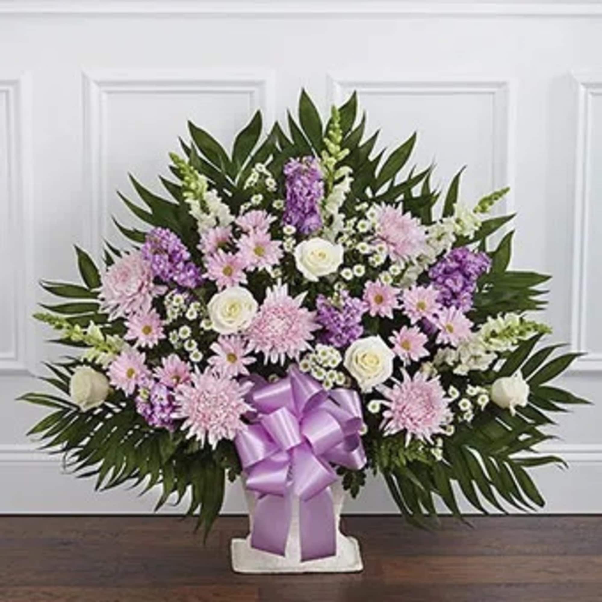 The purple and white flower sympathy floor basket is a wonderful gift
