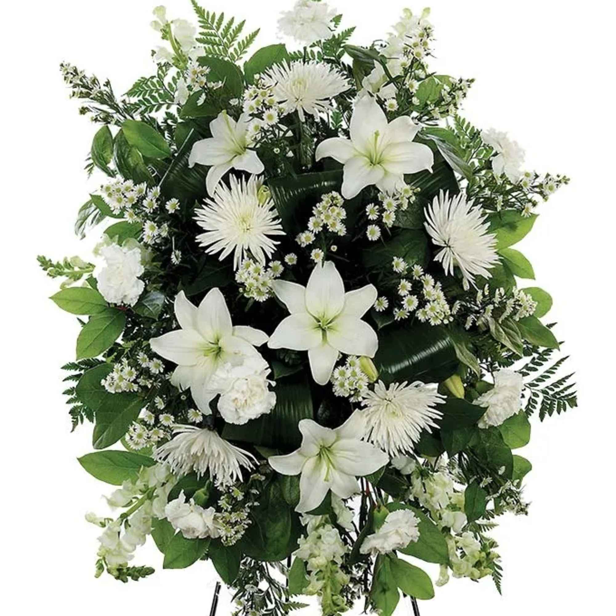 A classic white floral sympathy standing spray, with white carnations, white mums