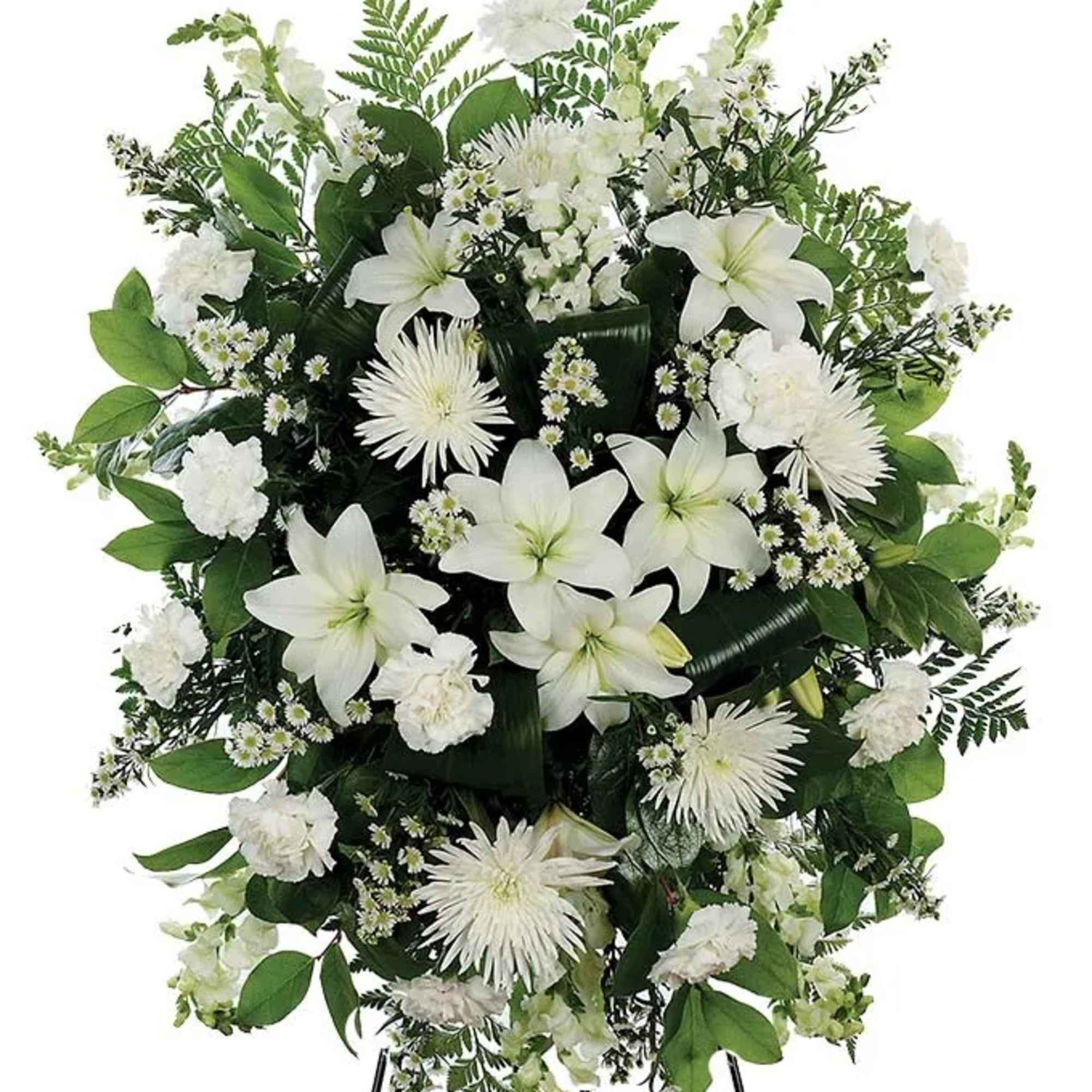 A classic white floral sympathy standing spray, with white carnations, white mums