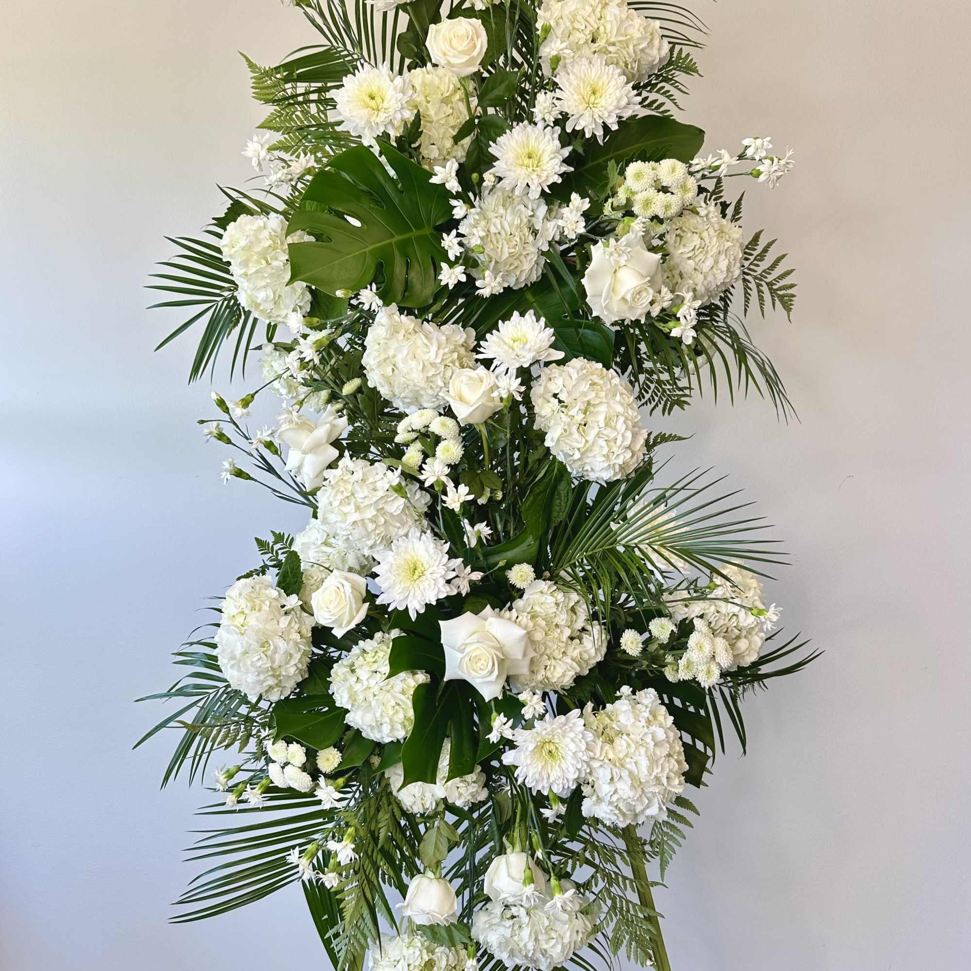 Honor a loved one with this tall white spray. 

Measures approximately 7.5