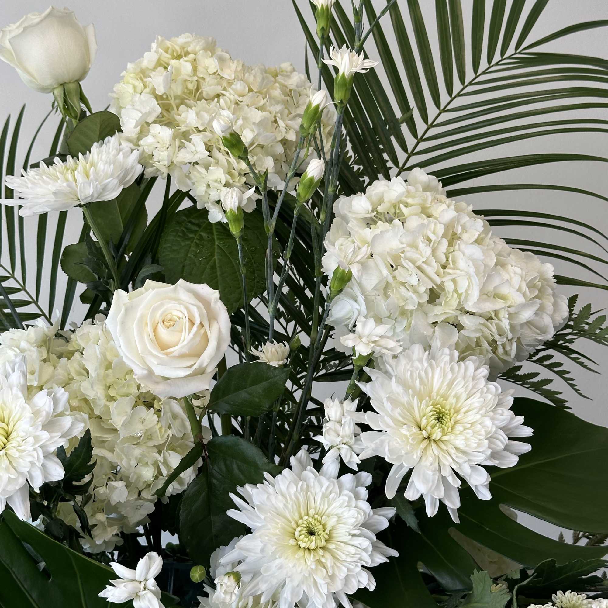 Honor a loved one with this tall white spray. 

Measures approximately 7.5