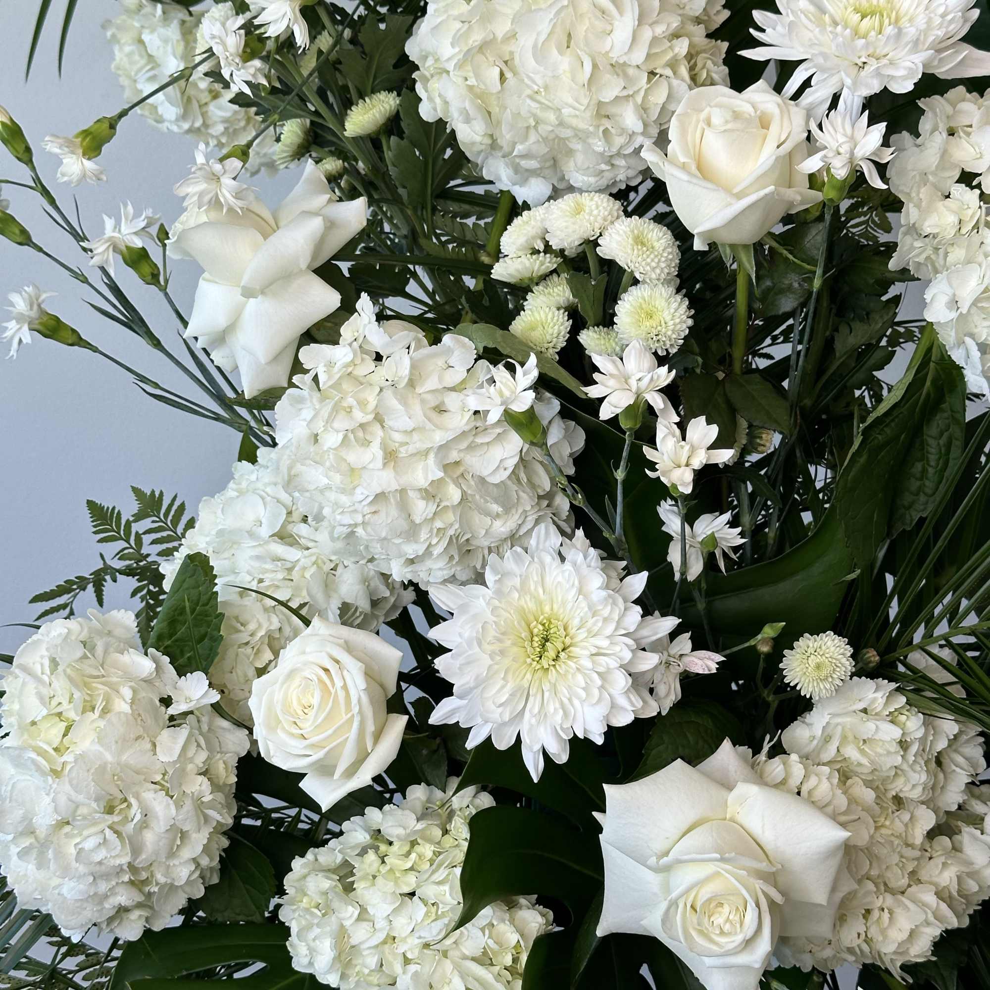 Honor a loved one with this tall white spray. 

Measures approximately 7.5