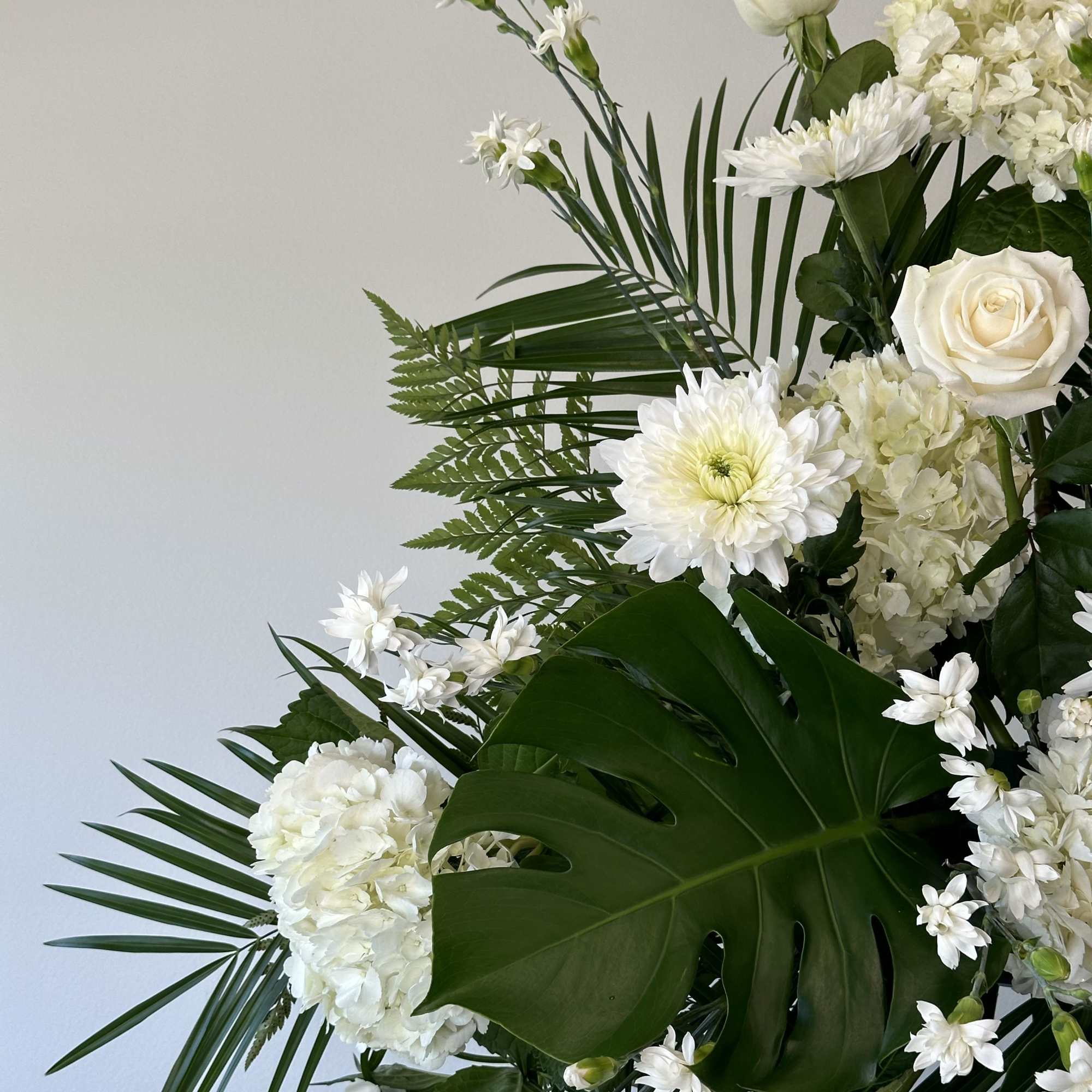 Honor a loved one with this tall white spray. 

Measures approximately 7.5