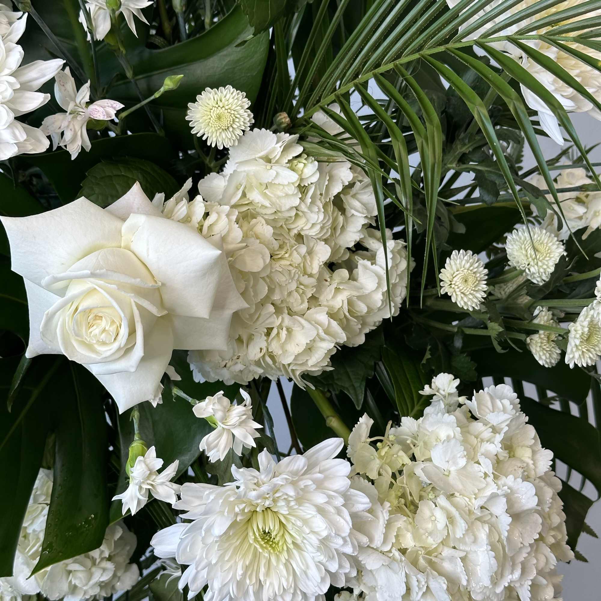 Honor a loved one with this tall white spray. 

Measures approximately 7.5