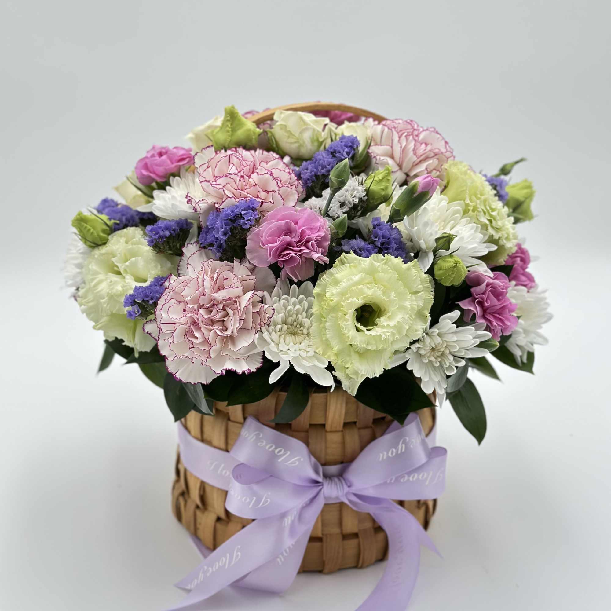 A sweet and compact floral basket featuring a delicate mix of fresh A sweet and compact floral basket featuring a delicate mix of fresh