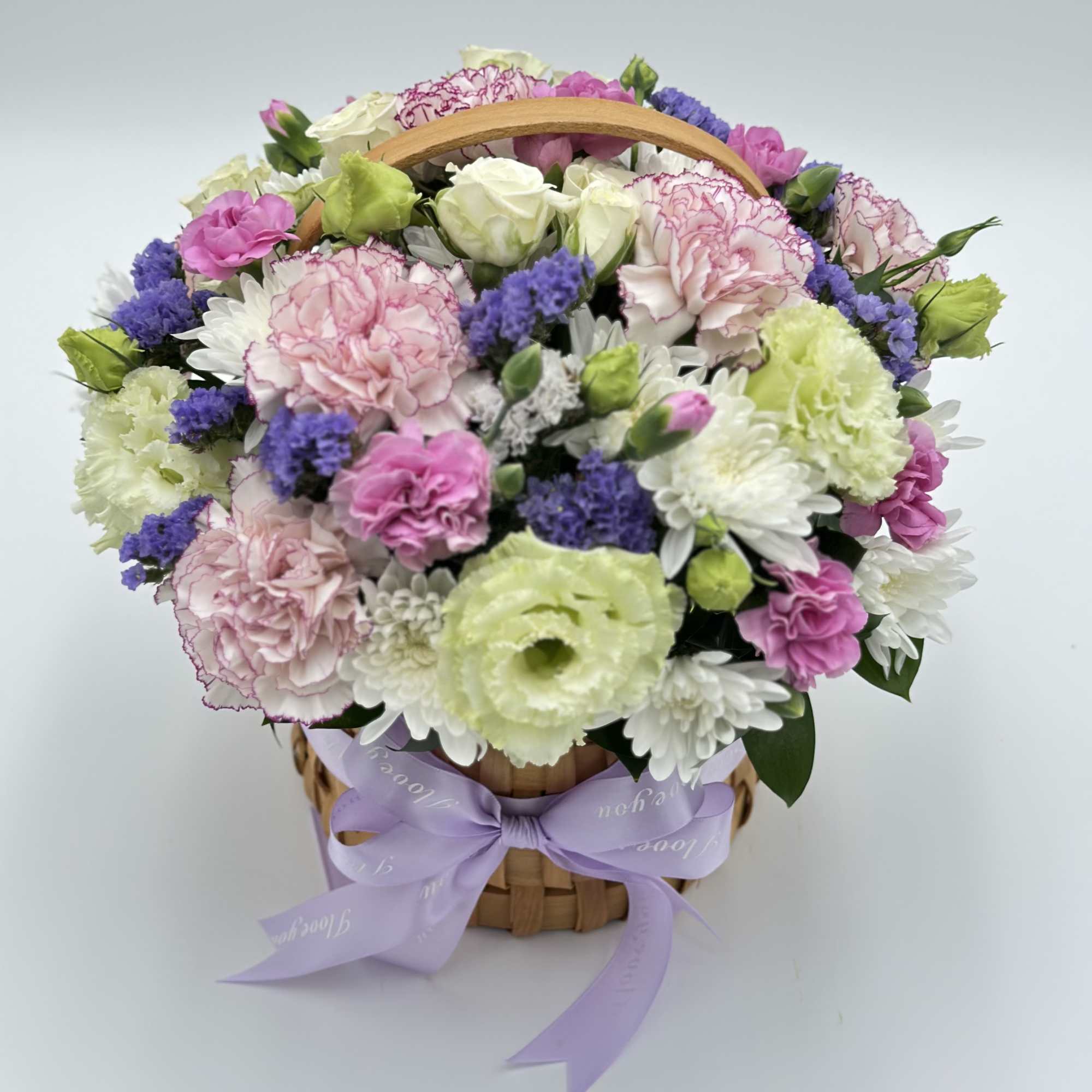 A sweet and compact floral basket featuring a delicate mix of fresh A sweet and compact floral basket featuring a delicate mix of fresh