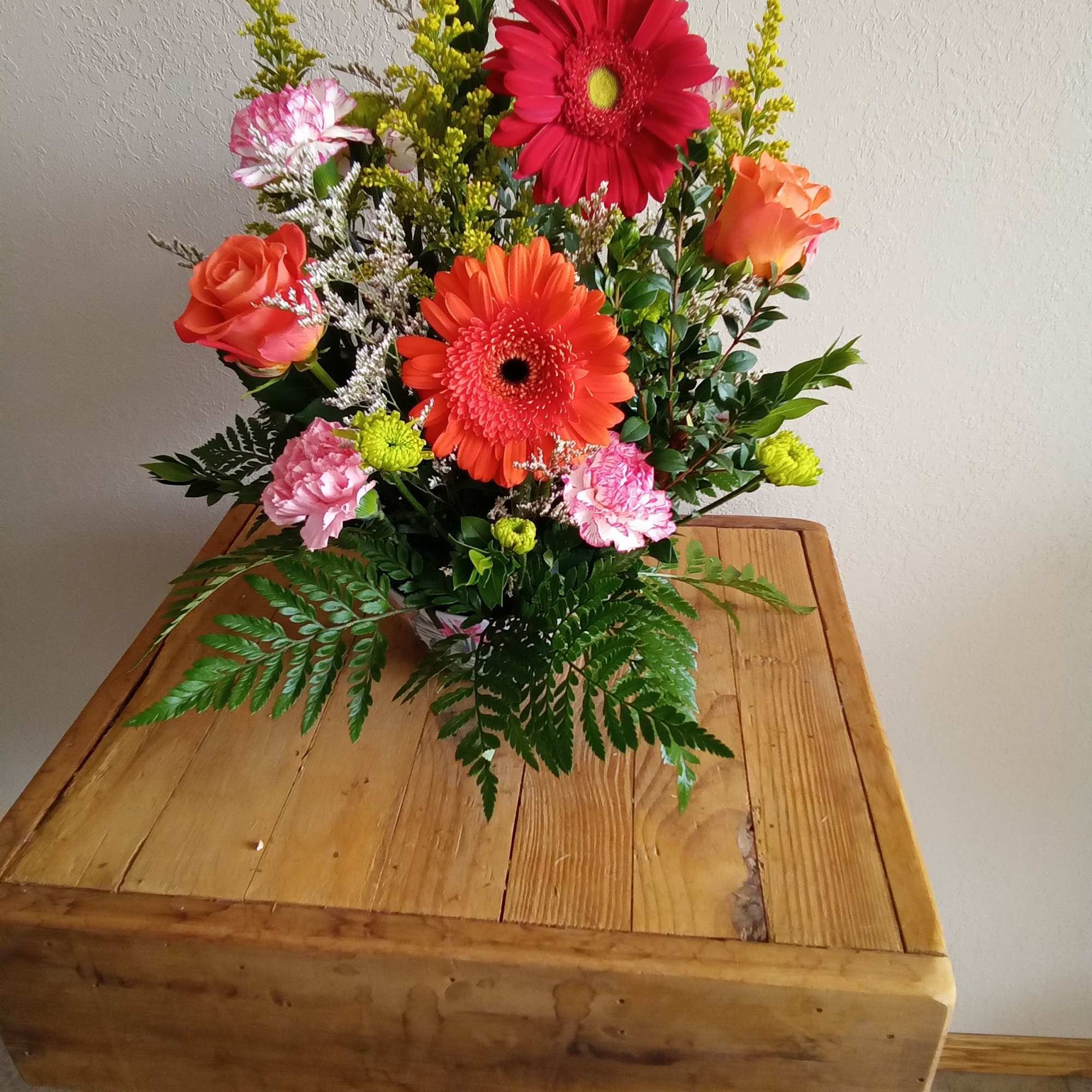 Send your festive congratulations along with this bright, cheery bowl of roses