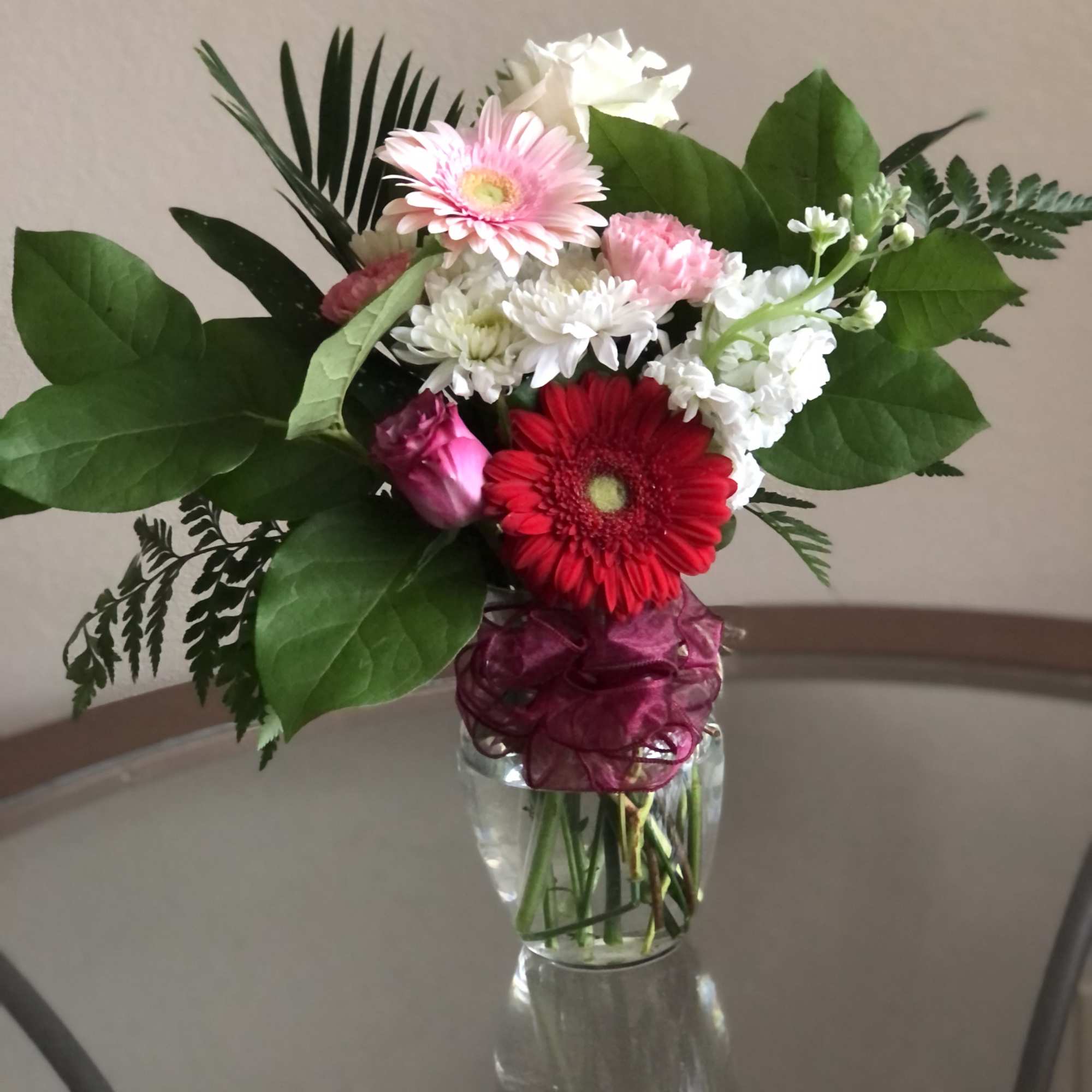 Send your festive congratulations along with this bright, cheery bowl of roses