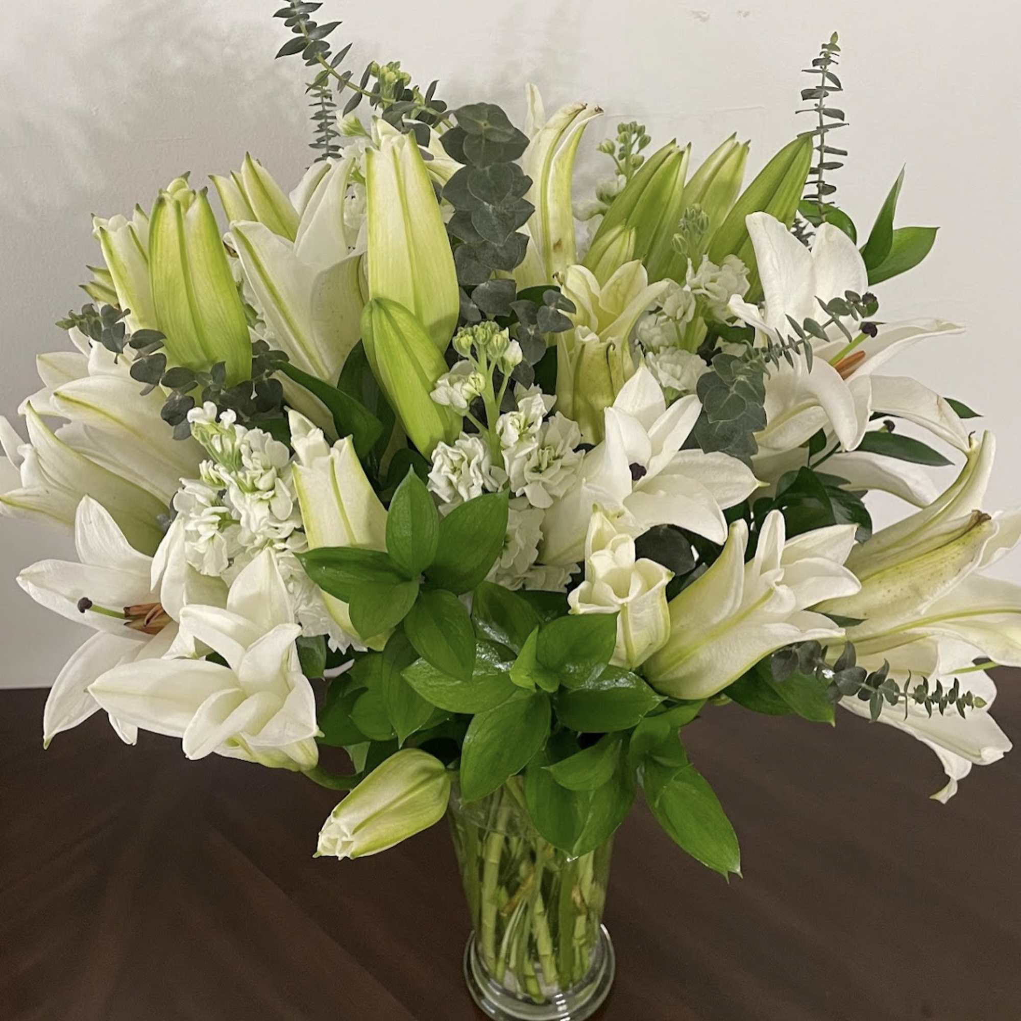 White lilies stand tall and beautiful. Send an impactful gift to somebody