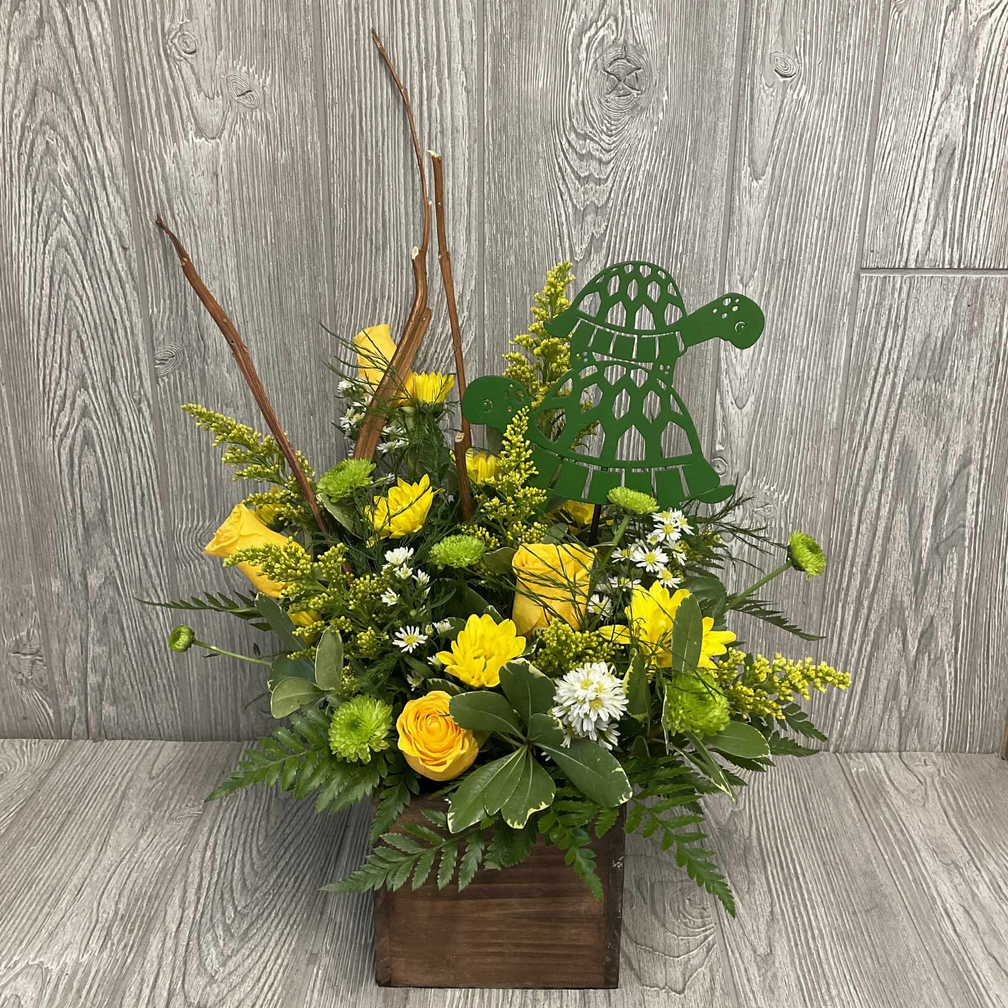 Cute turtle arrangement in a wooden box with a metal turtle pick Cute turtle arrangement in a wooden box with a metal turtle pick