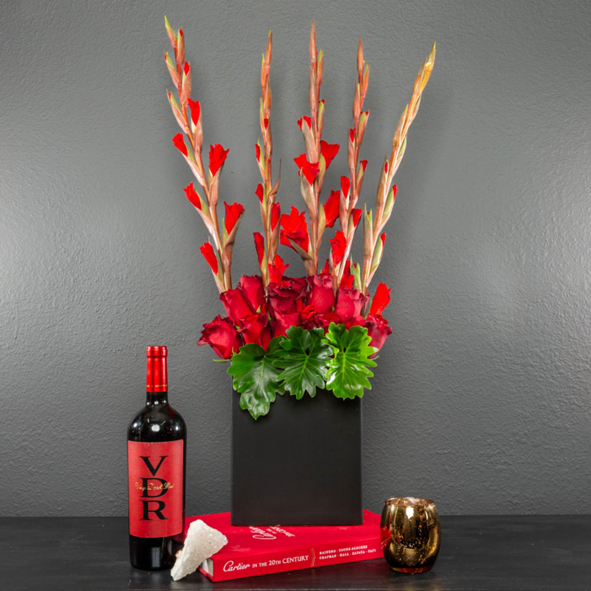 This stunning, long lasting arrangement is made of gorgeous gladiolus, and roses