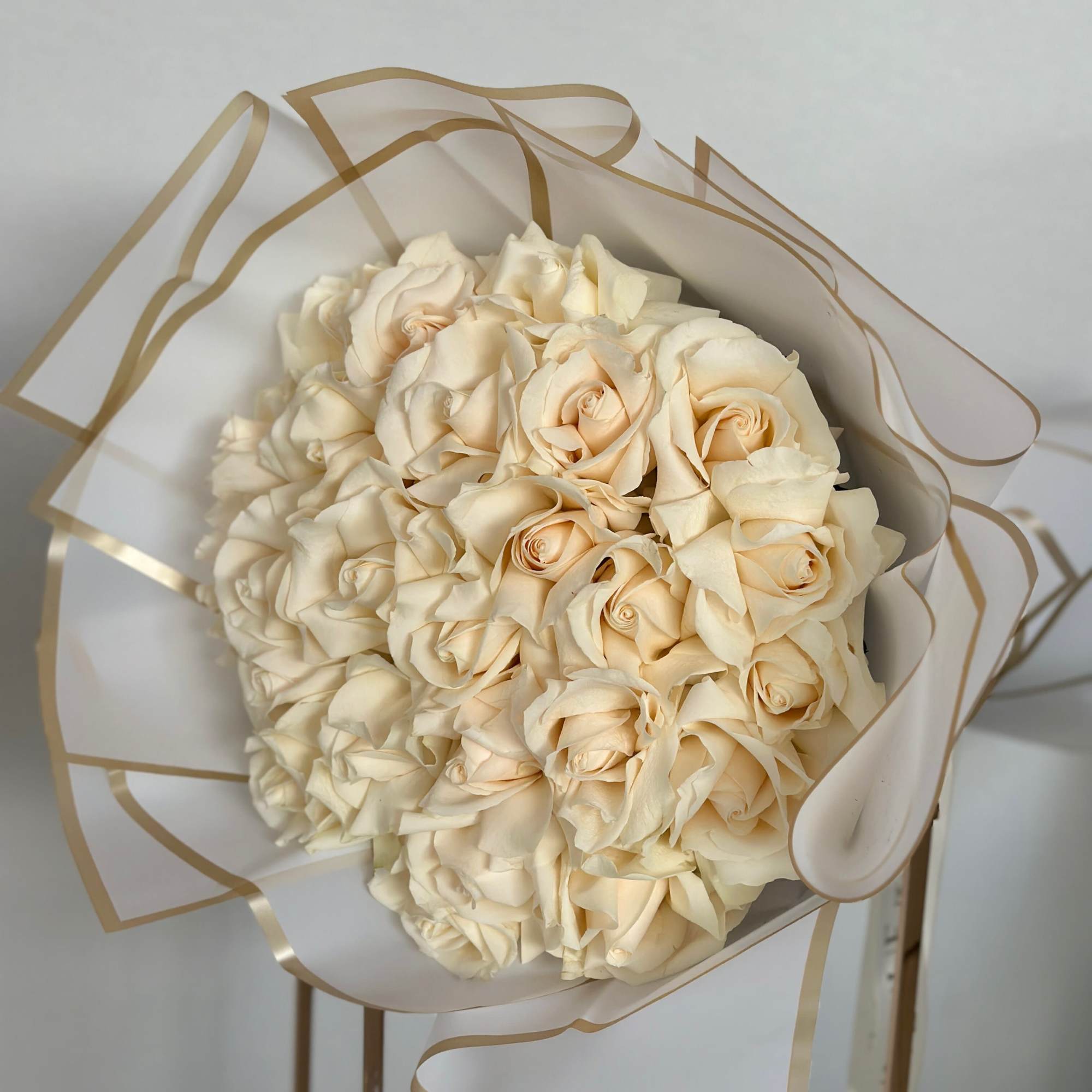 This stunning bouquet of soft white roses is the epitome of timeless