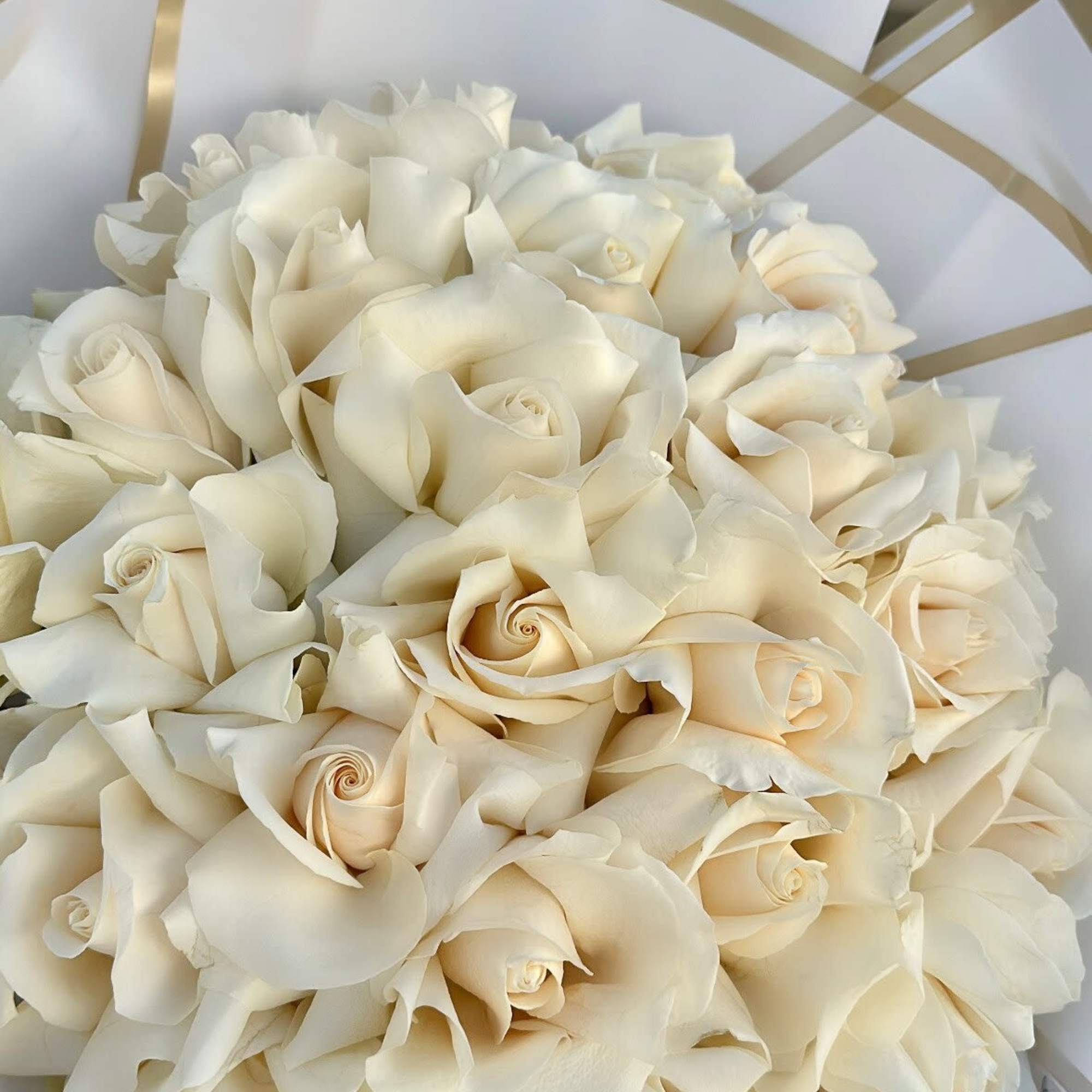 This stunning bouquet of soft white roses is the epitome of timeless