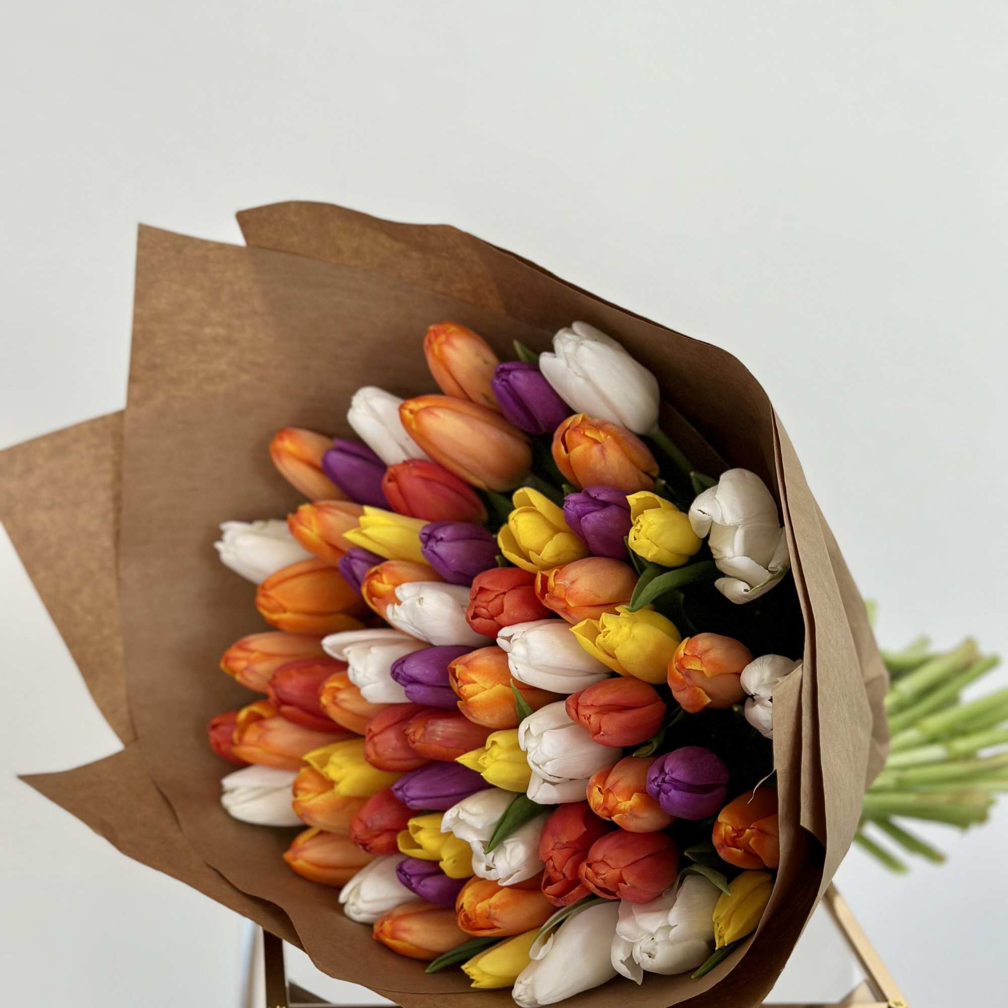 Bursting with vibrancy and energy, this exquisite arrangement features an array of