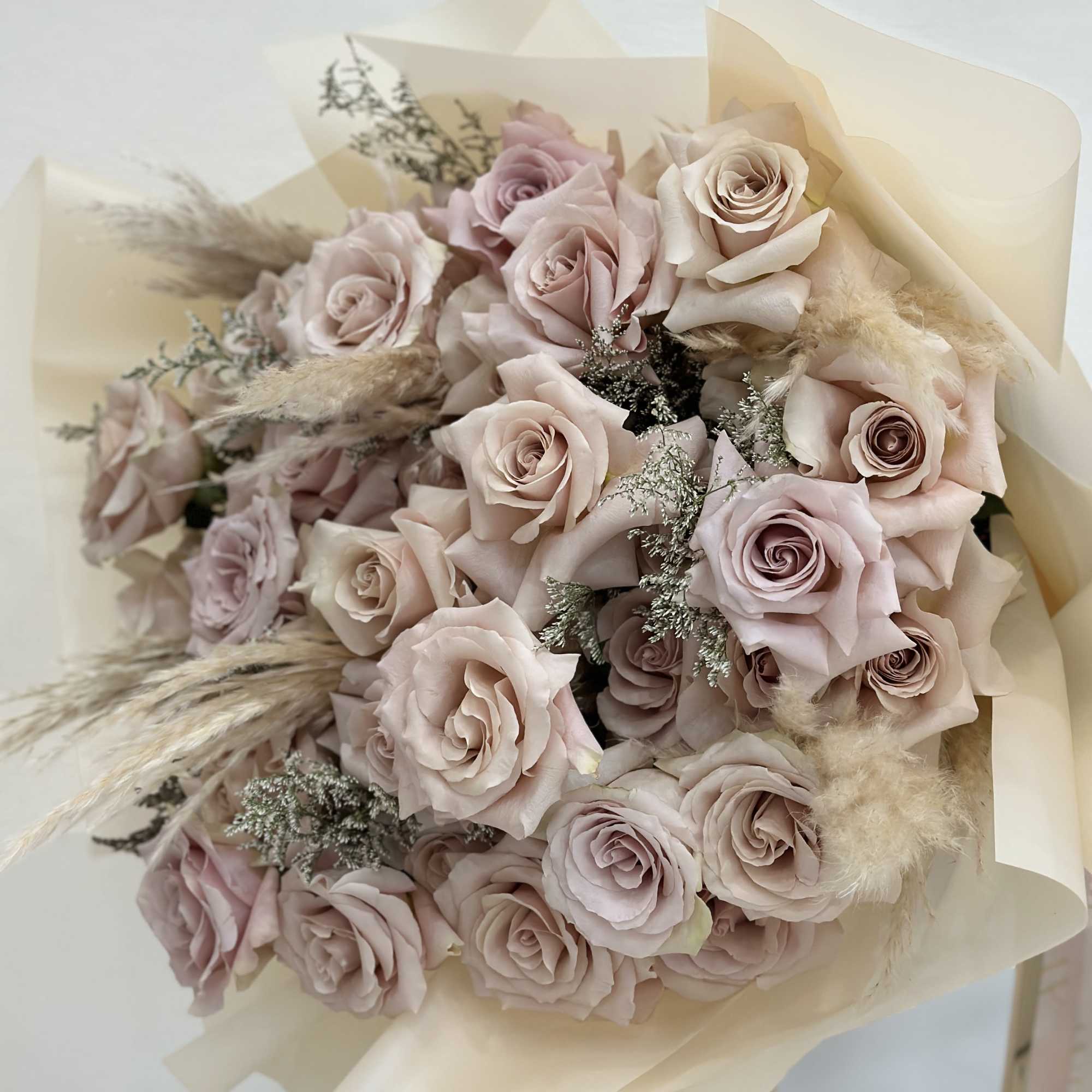 Introducing the &quot;Elegance Bouquet&quot; featuring a mesmerizing array of soft beige roses