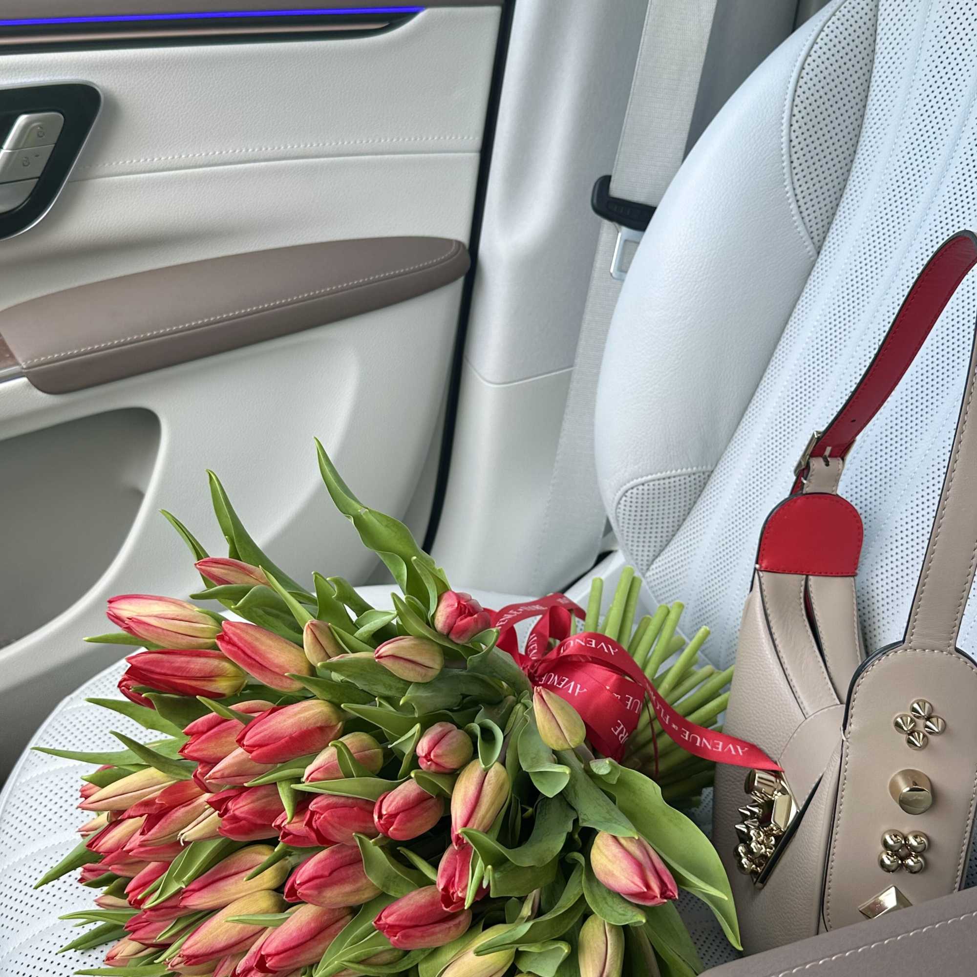 Behold the timeless elegance of our Red Tulip Bouquet, a captivating ensemble
