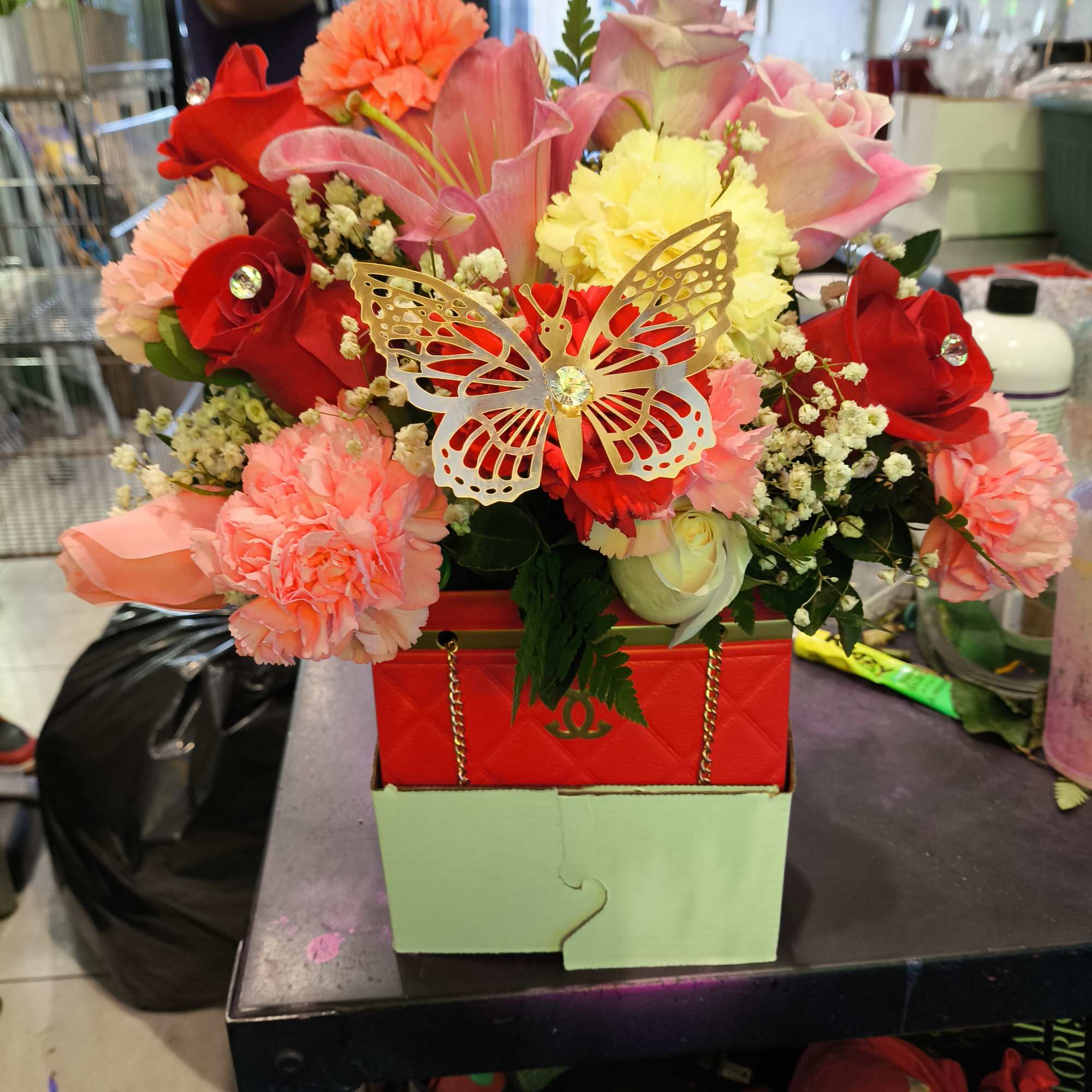 I make these designer gift boxes with flowers in red and black