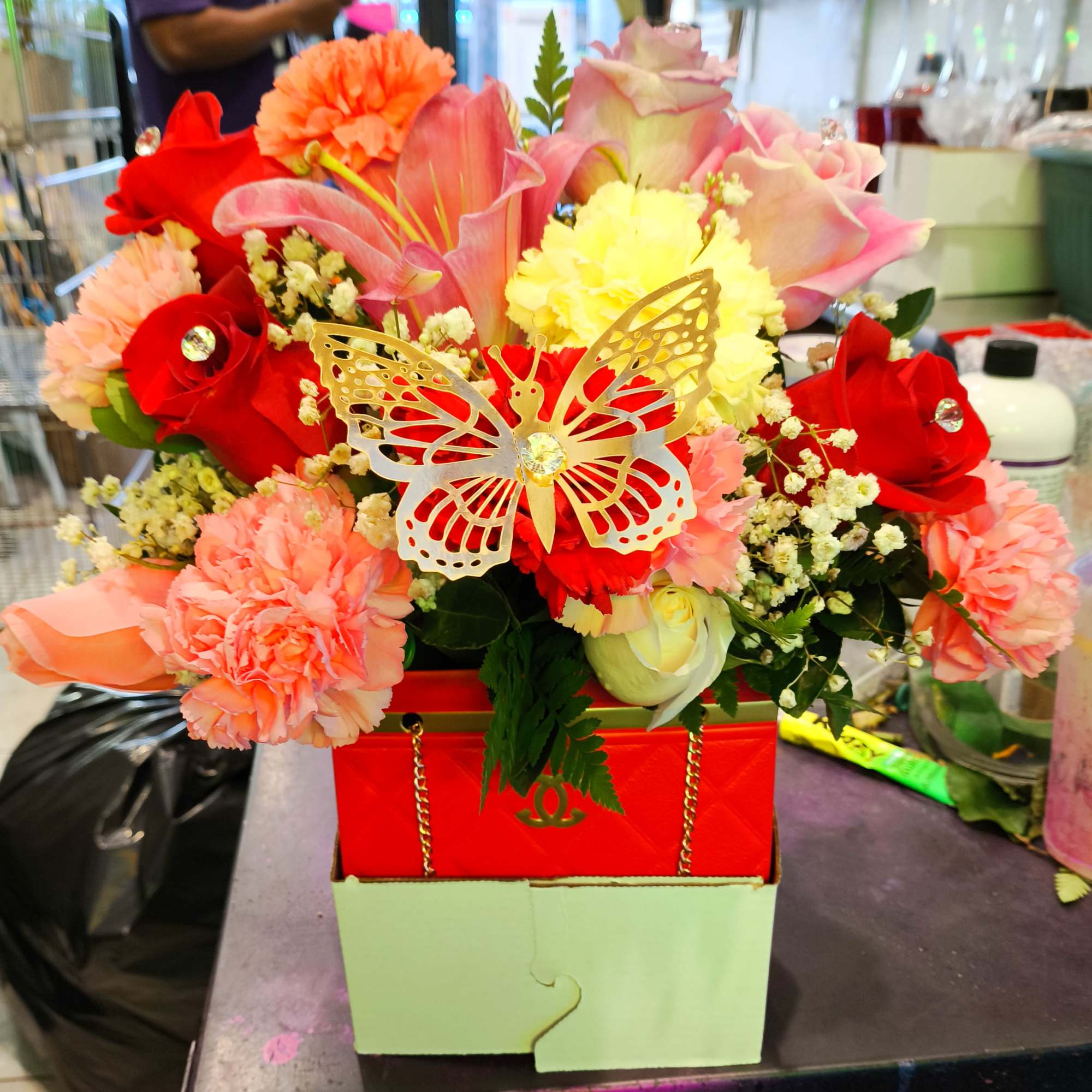 I make these designer gift boxes with flowers in red and black