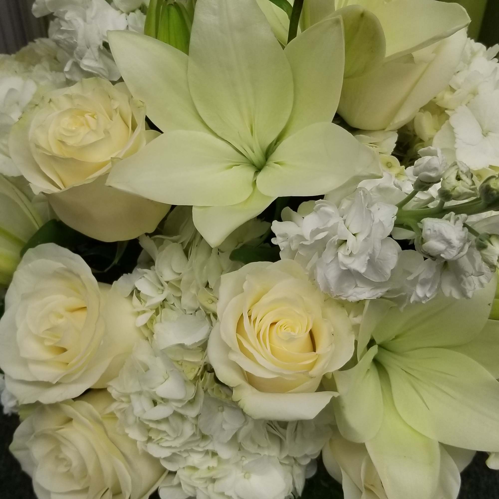 This arrangement is designed in a heavy luxury faceted vase.  It