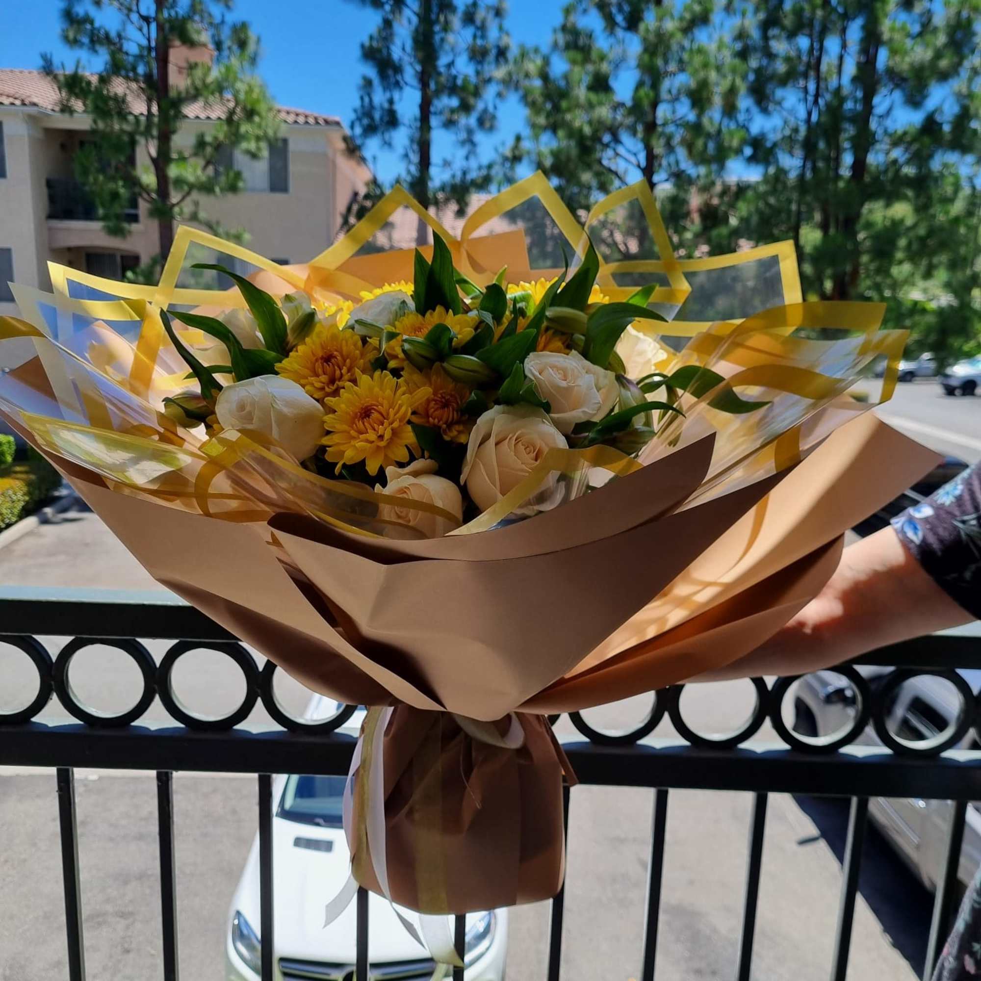 Ivory Whisper is a timeless bouquet featuring elegant white roses nestled among