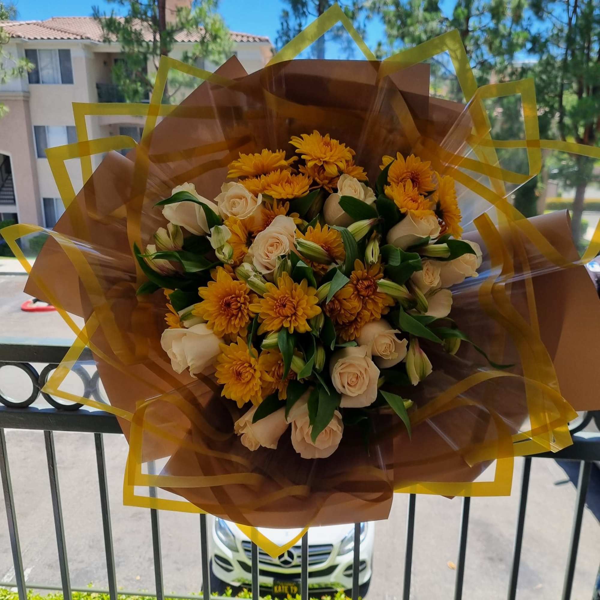 Ivory Whisper is a timeless bouquet featuring elegant white roses nestled among