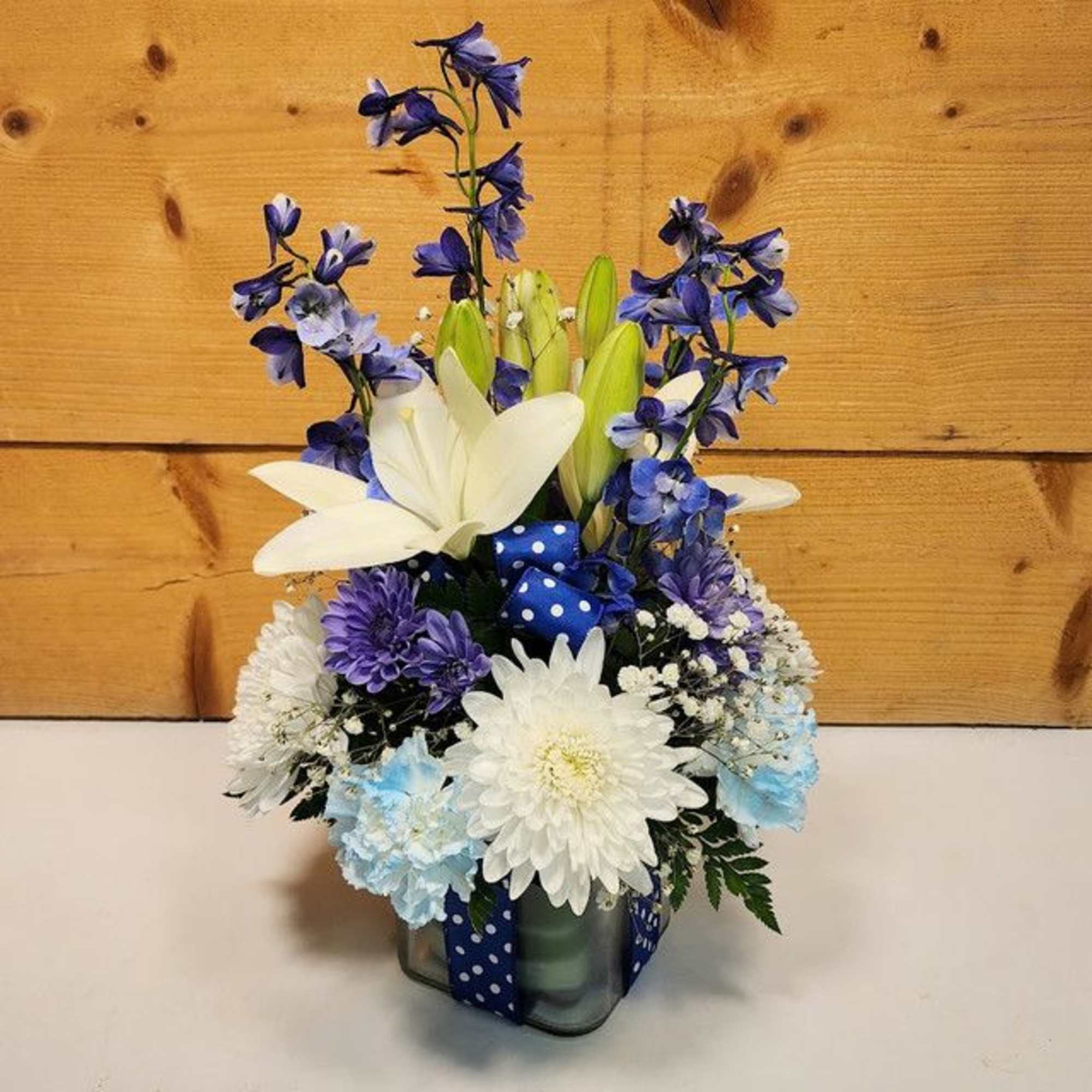 Welcome a new baby boy with this charming floral arrangement, thoughtfully presented Welcome a new baby boy with this charming floral arrangement, thoughtfully presented