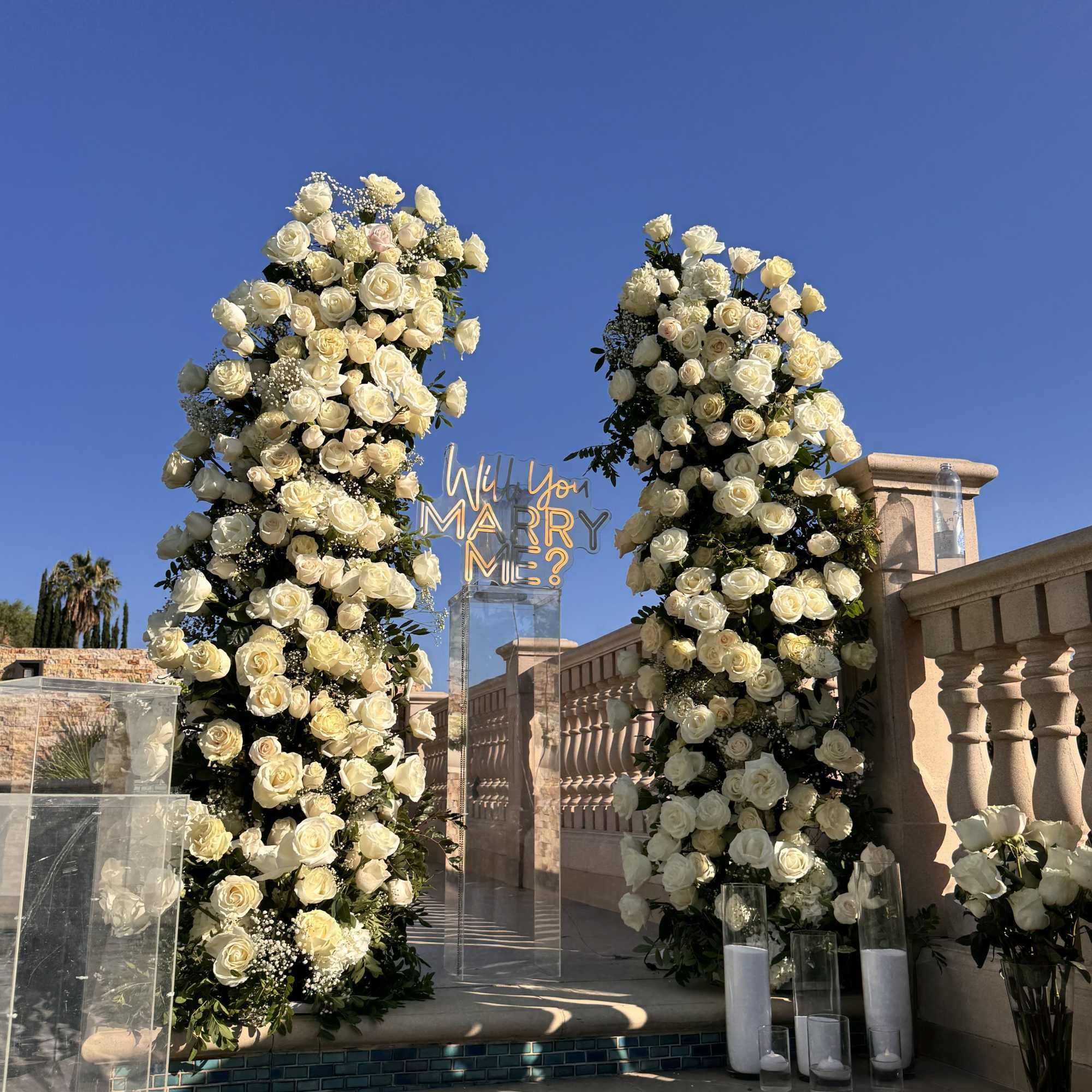 
Create an unforgettable proposal moment with this stunning floral arch, crafted with