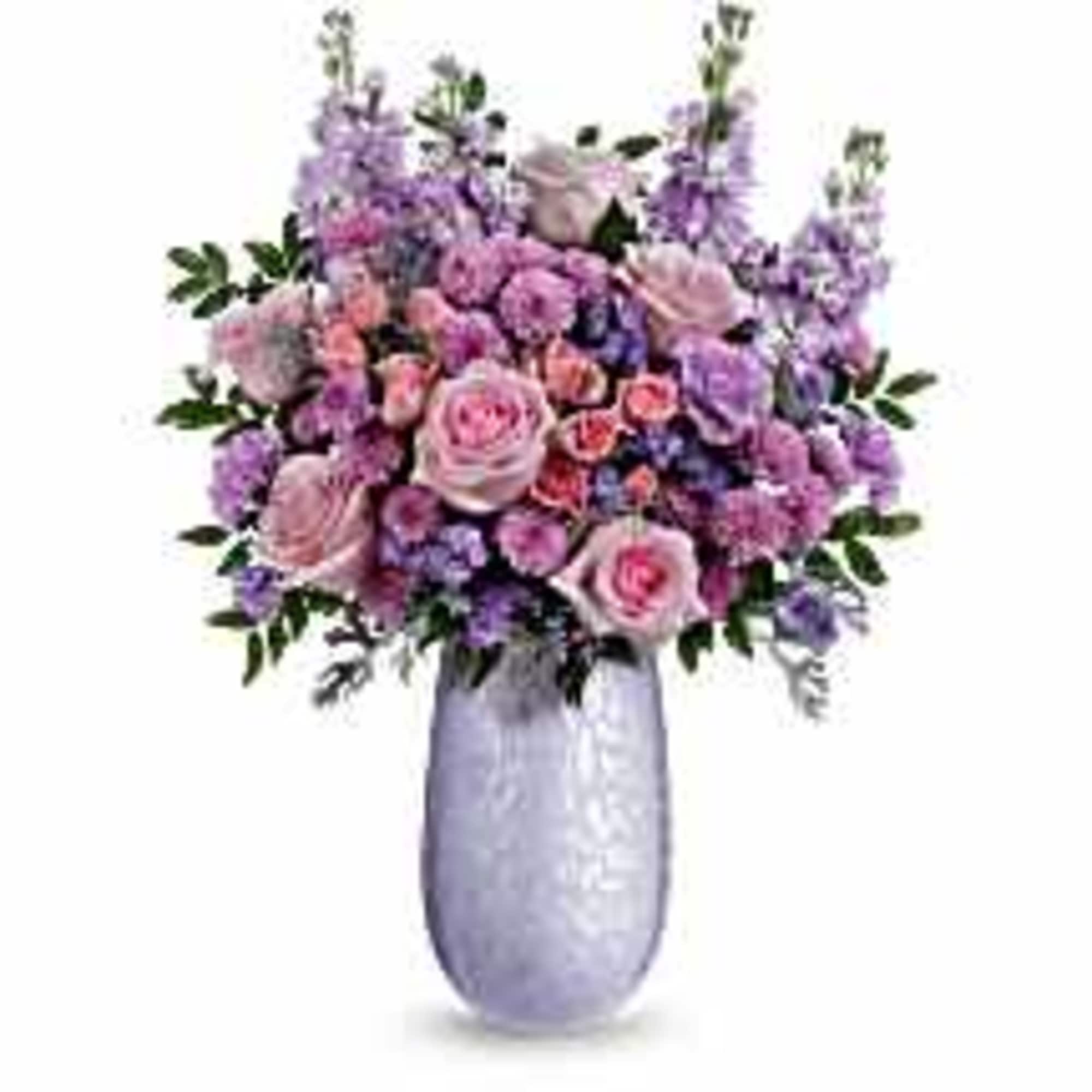 What a treat! Overflowing with pink roses and lavender blooms, this stunning