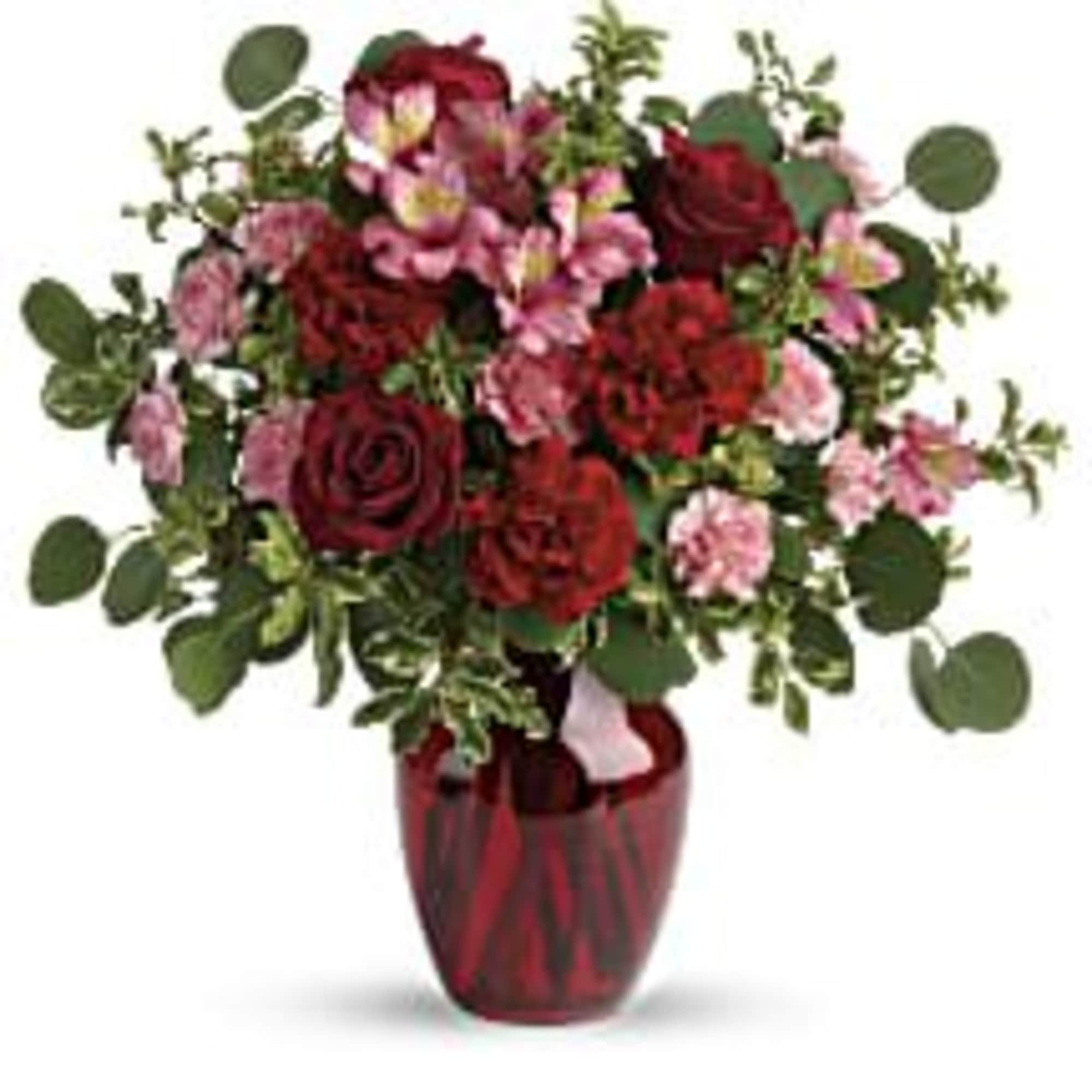 
The belle of the ball! Arranged in a ruby red vase, this