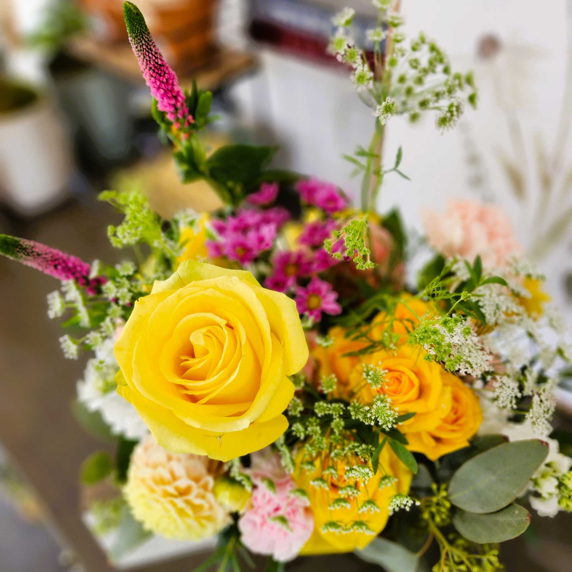 Bright and cheerful, like sunlight on a clear day. An arrangement to