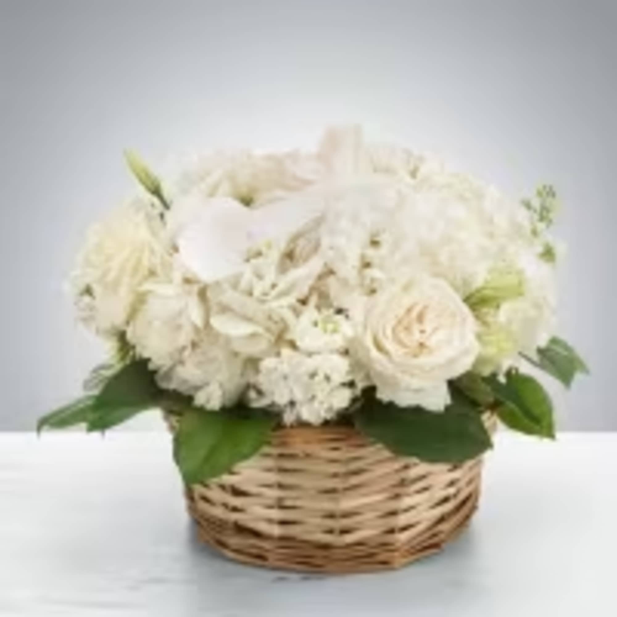 Send this all-white arrangement to the family's home to let them know Send this all-white arrangement to the family's home to let them know