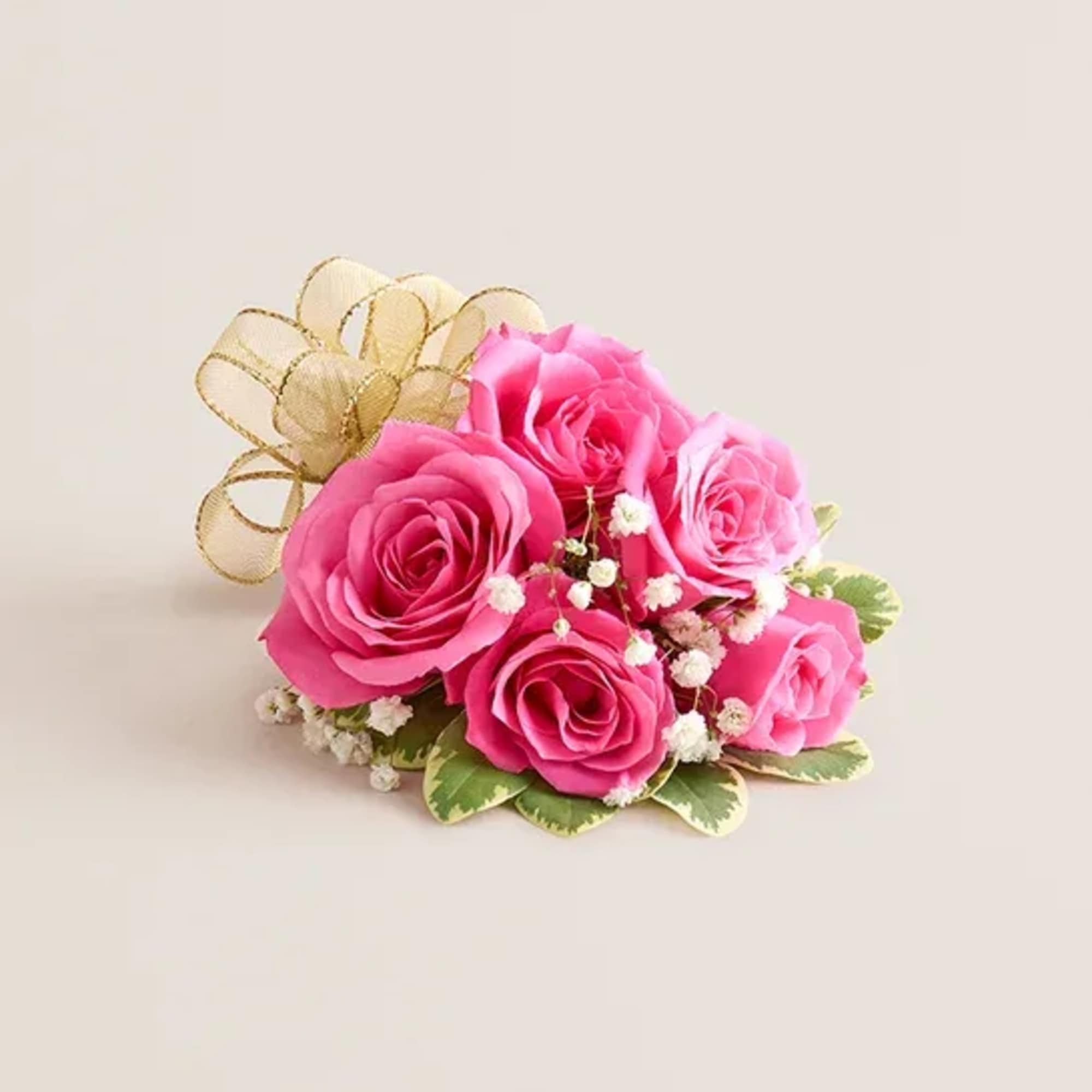 A pink corsage is a delicate floral accessory that radiates charm and A pink corsage is a delicate floral accessory that radiates charm and