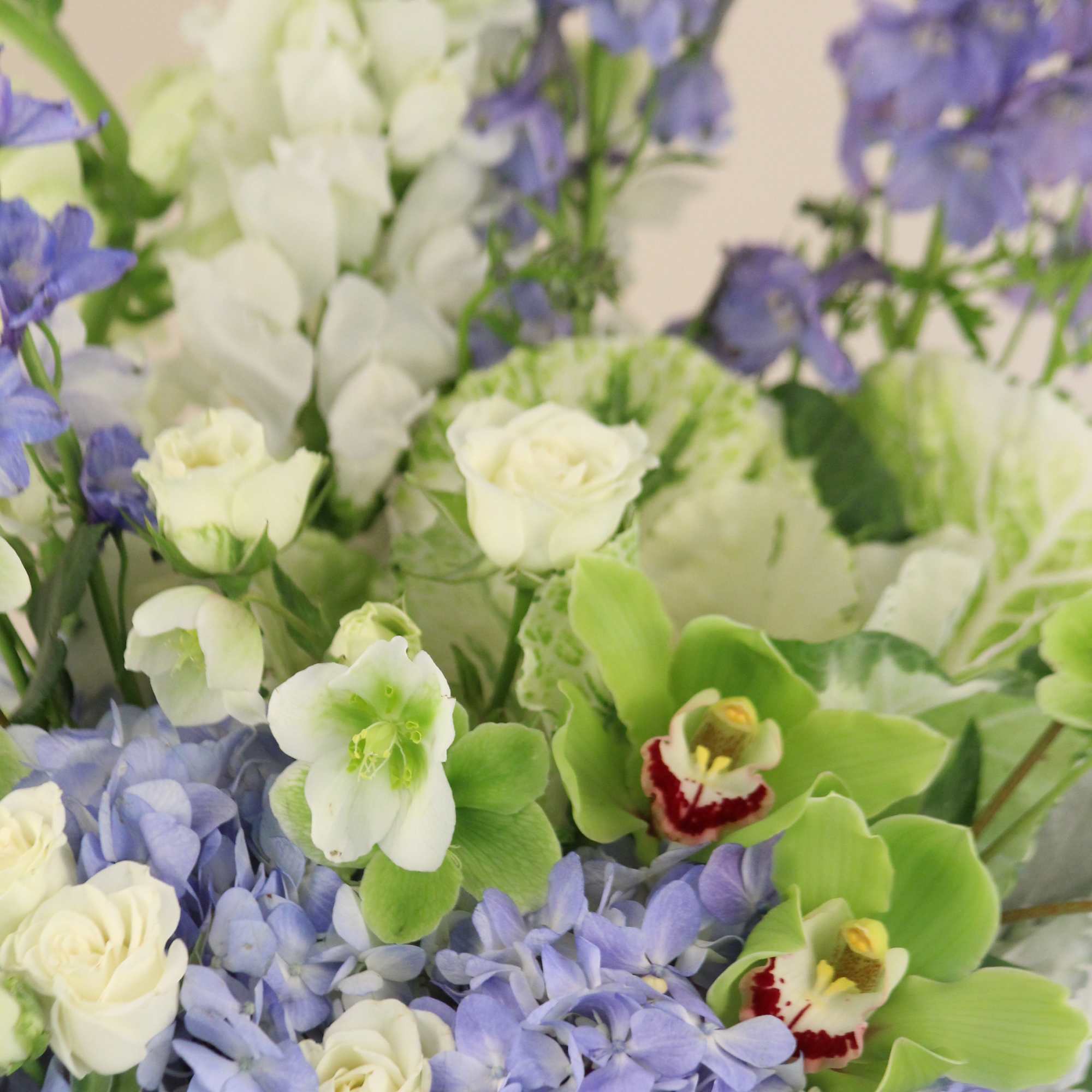 A lush arrangement of blues and whites in a white wash wooden