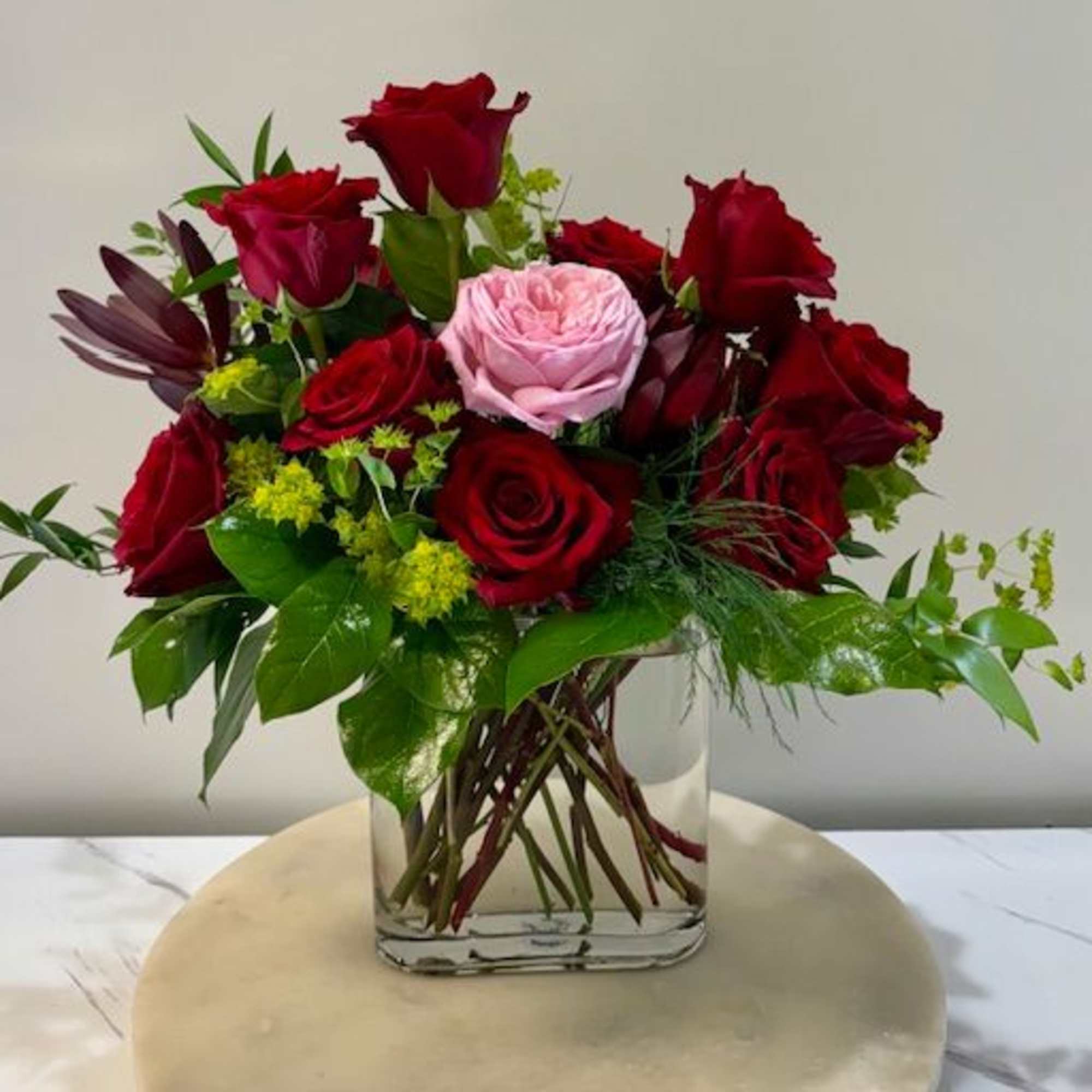 A breathtaking arrangement that speaks of love, devotion, and individuality. Eleven deep A breathtaking arrangement that speaks of love, devotion, and individuality. Eleven deep