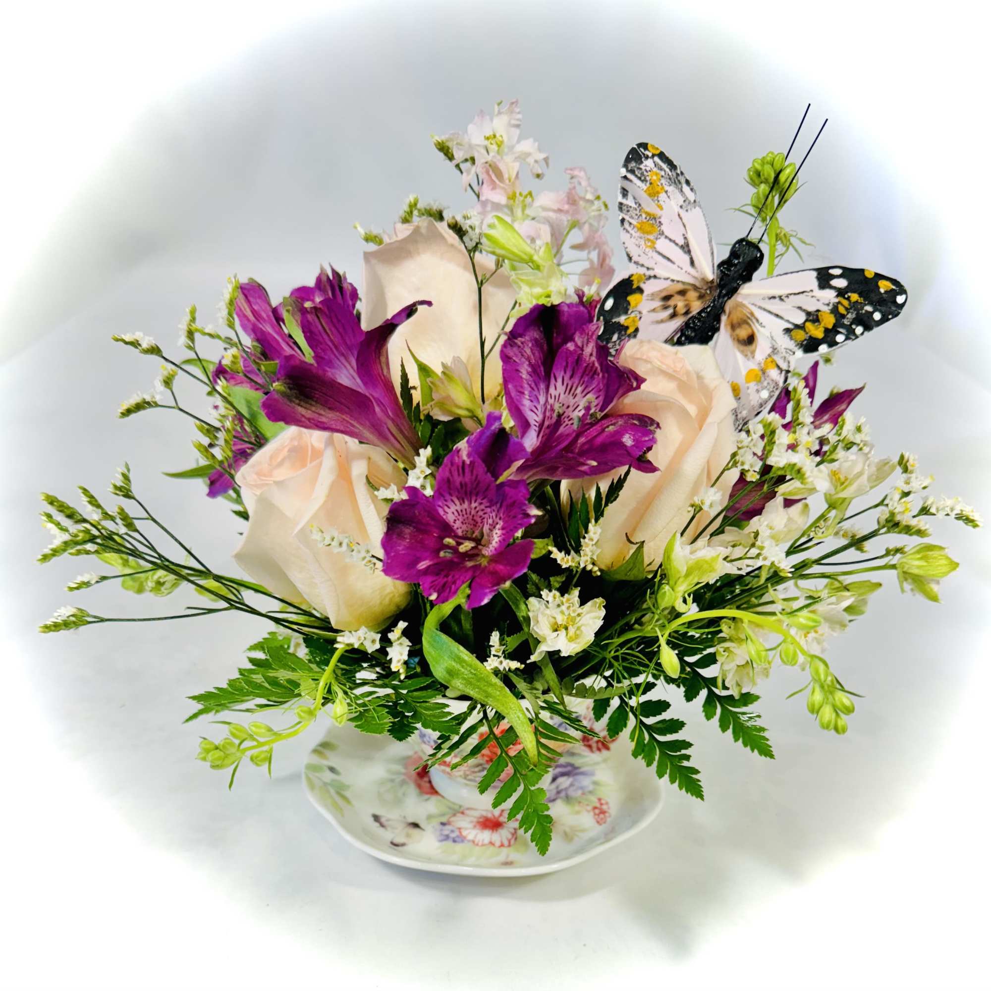 This lovely floral gift offers fresh flowers in a charming ceramic teacup This lovely floral gift offers fresh flowers in a charming ceramic teacup