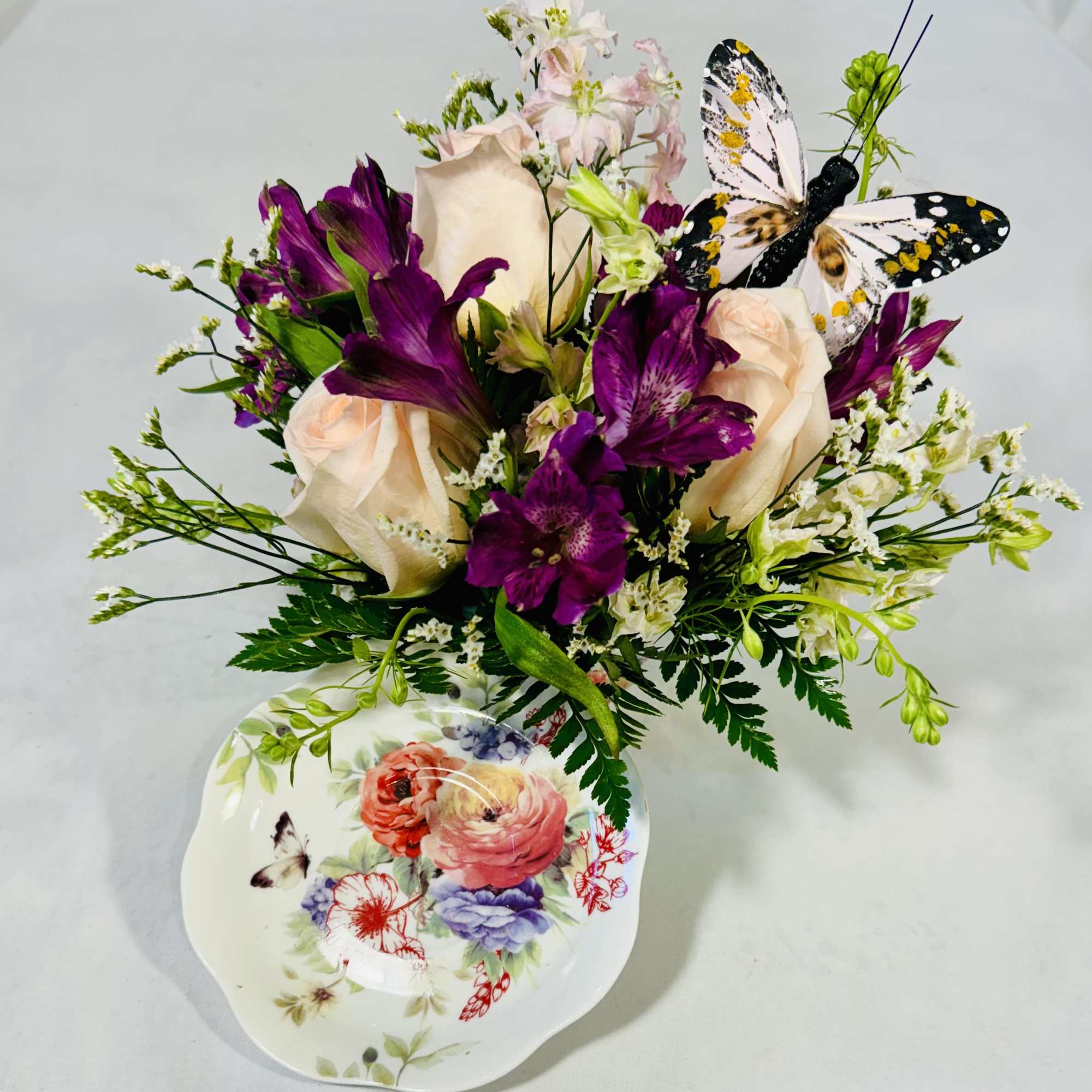 This lovely floral gift offers fresh flowers in a charming ceramic teacup This lovely floral gift offers fresh flowers in a charming ceramic teacup