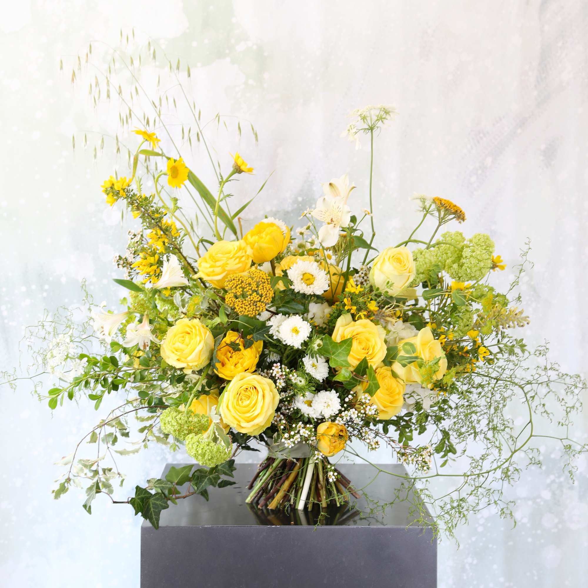 This yellow and Green color combination handtie bouquet arrangement brings in a