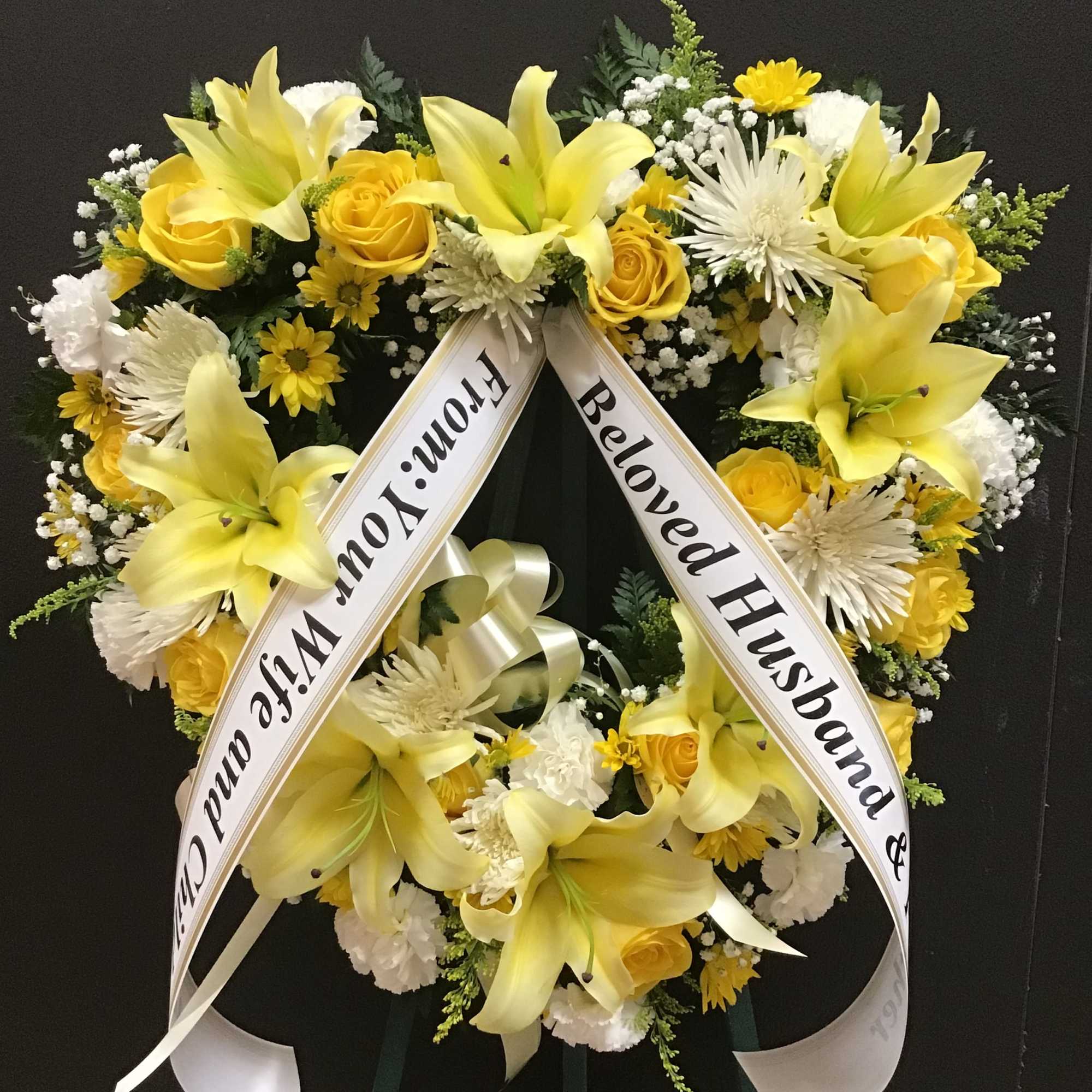 This open heart make with lilies, roses, daisy , carnations and baby&#039;s