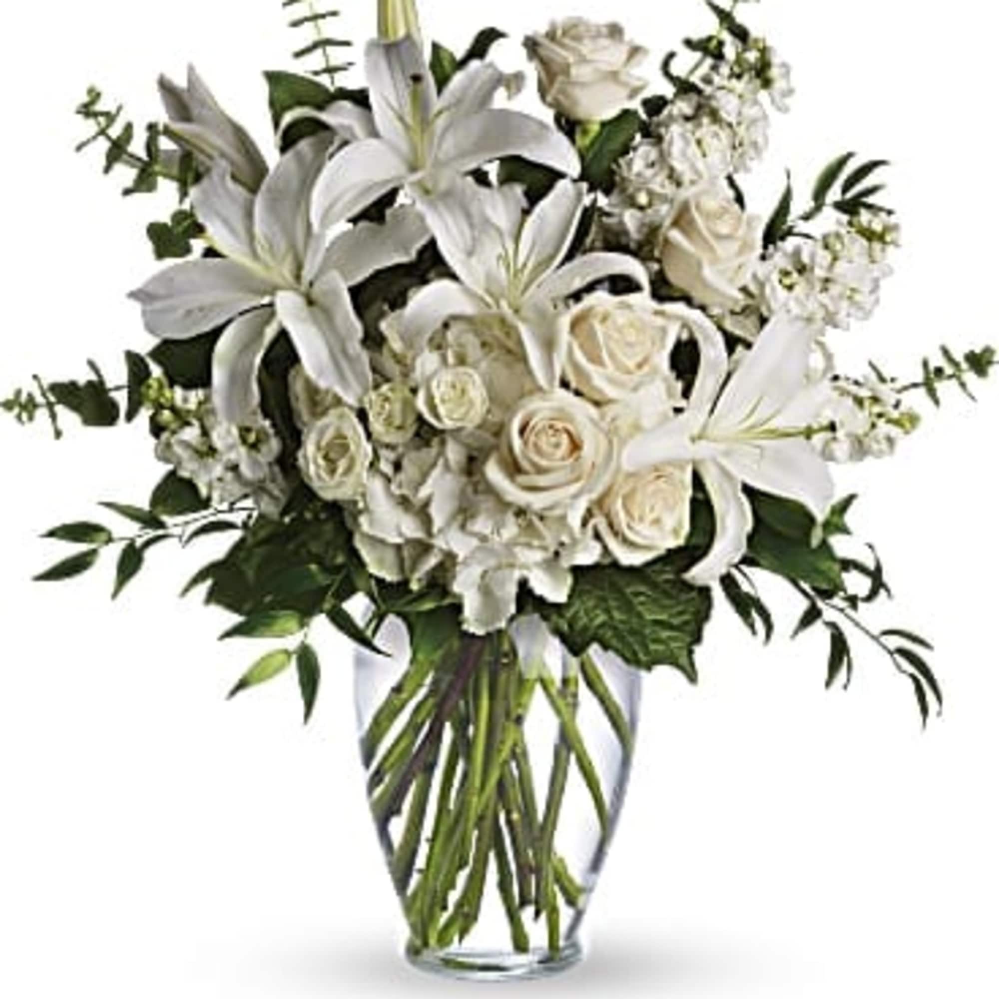 This gorgeous bouquet overflows with white hydrangea, cr&egrave;me roses, white spray roses
