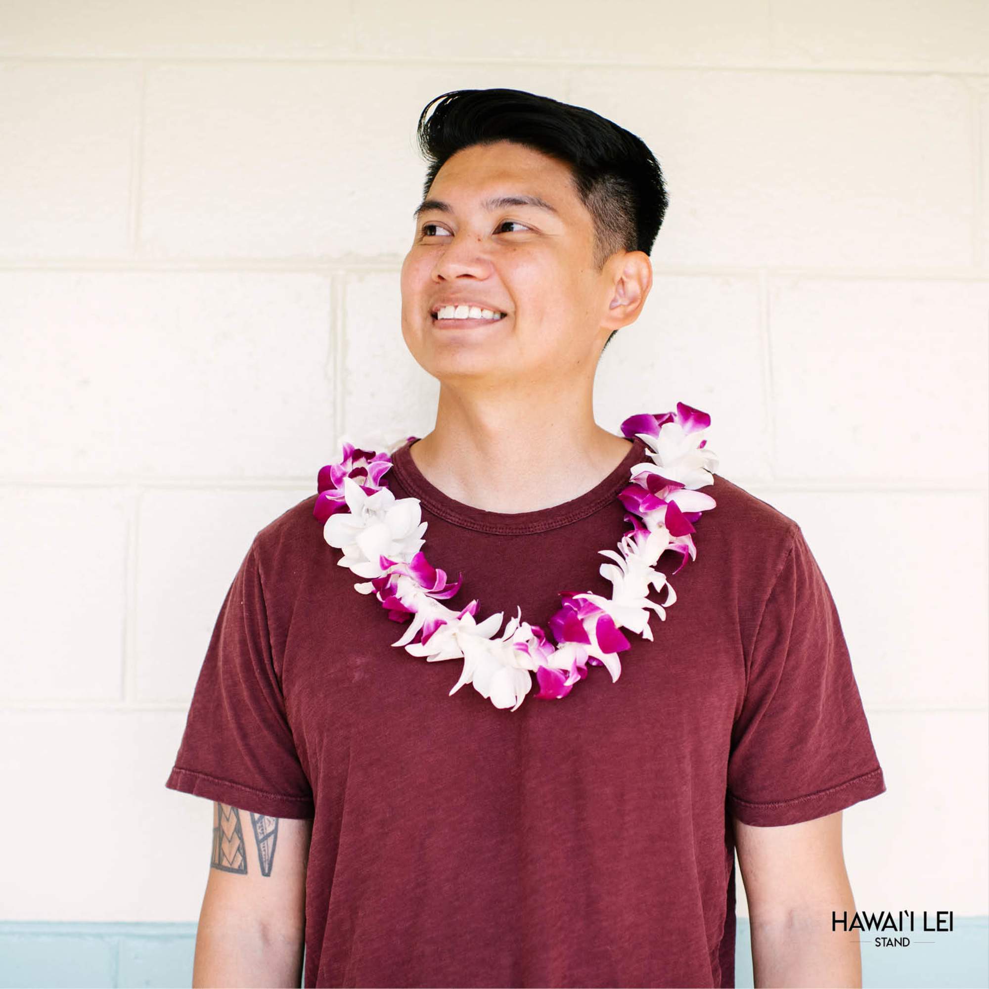 This beauty features a winning combination of purple and white orchids strung