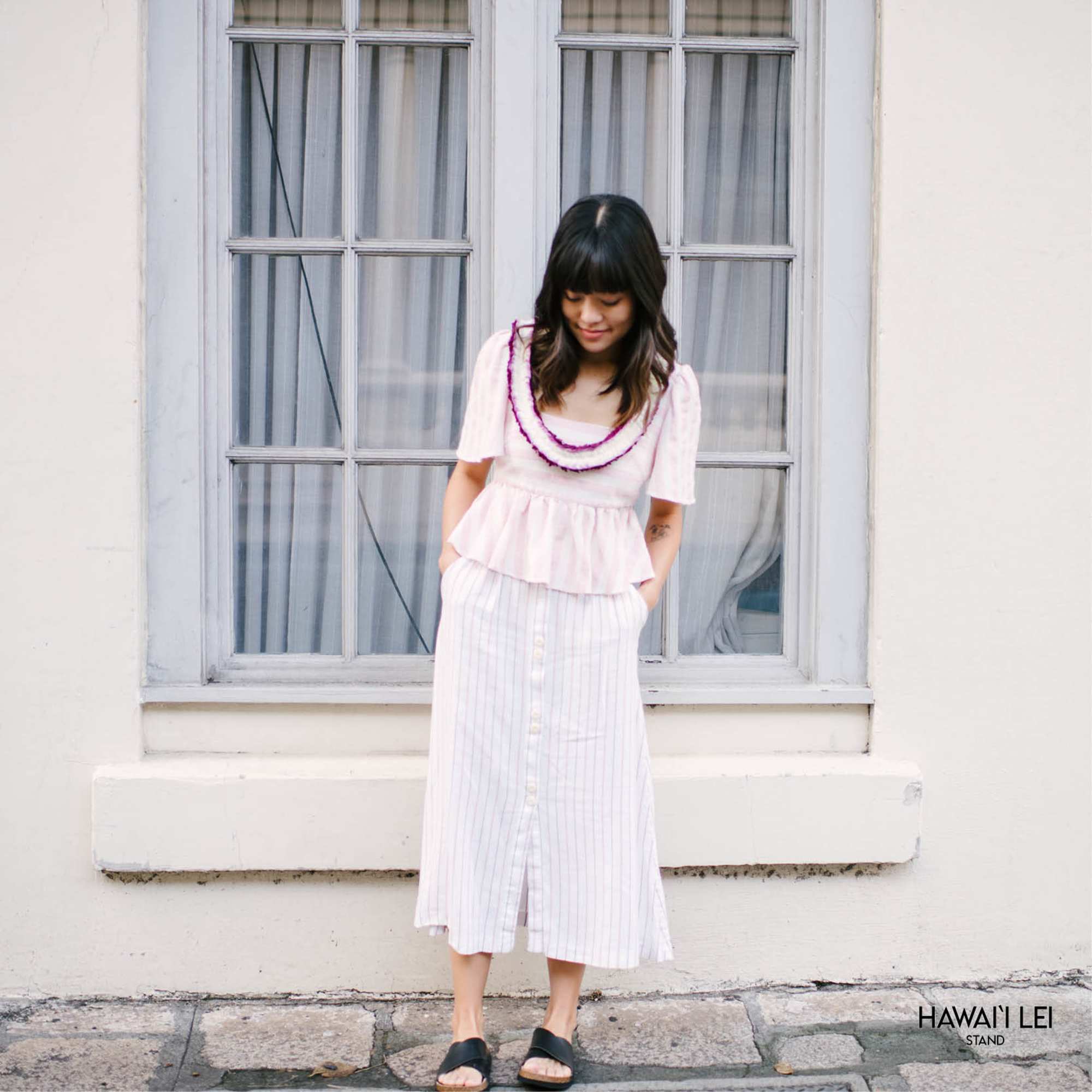 Our Christina lei is truly a sight to behold, featuring purple dendrobium