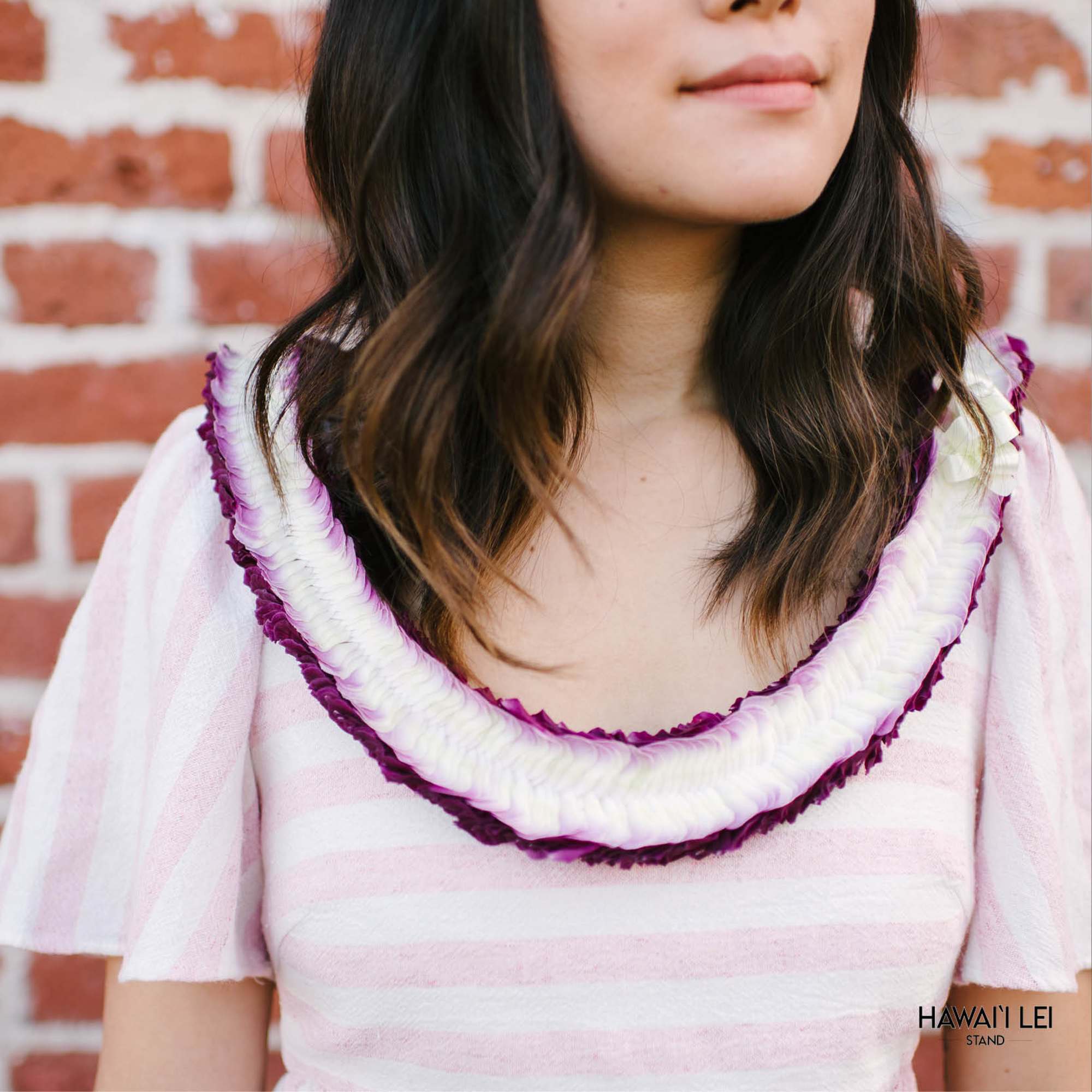 Our Christina lei is truly a sight to behold, featuring purple dendrobium