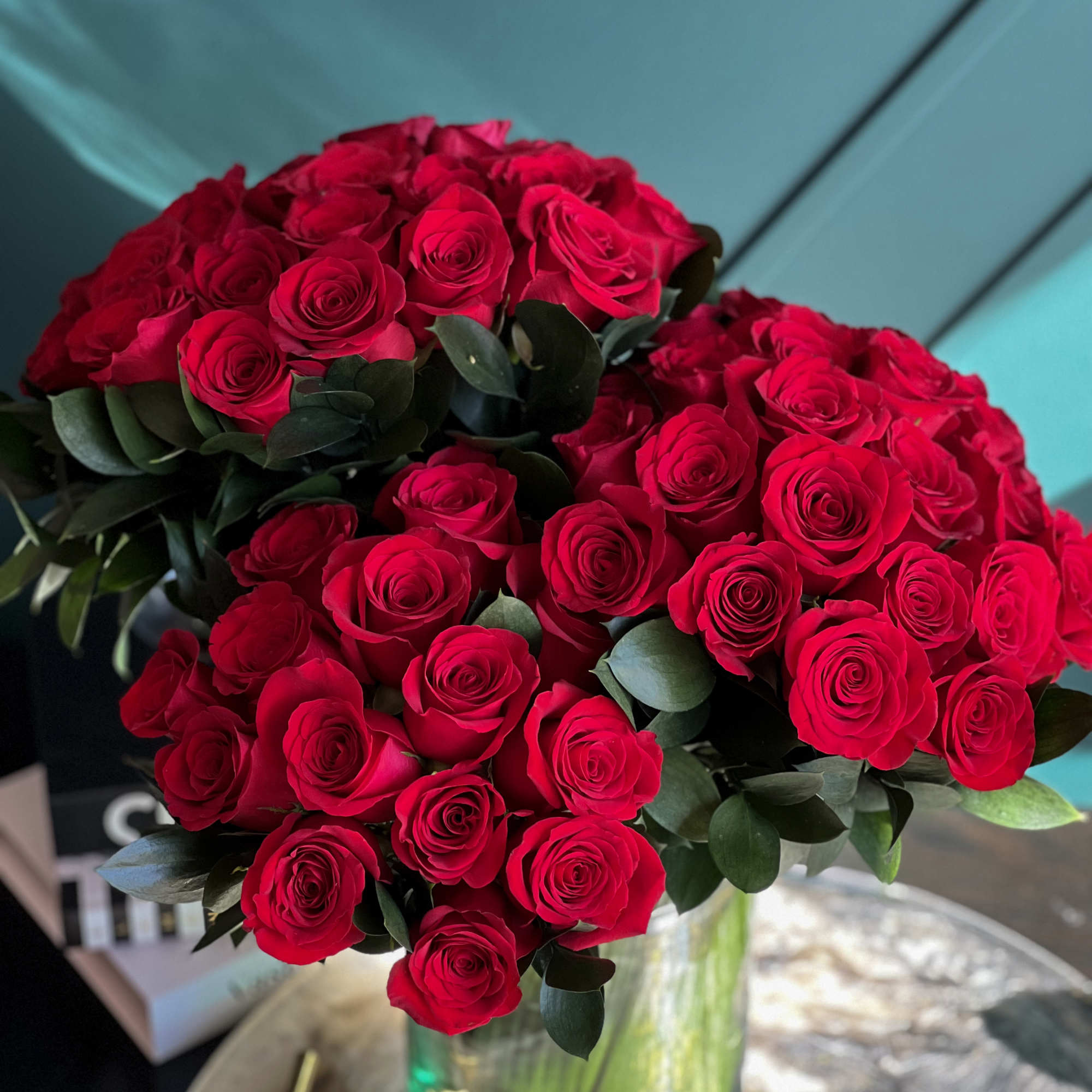 6 dozen fresh cut red roses in clear vase